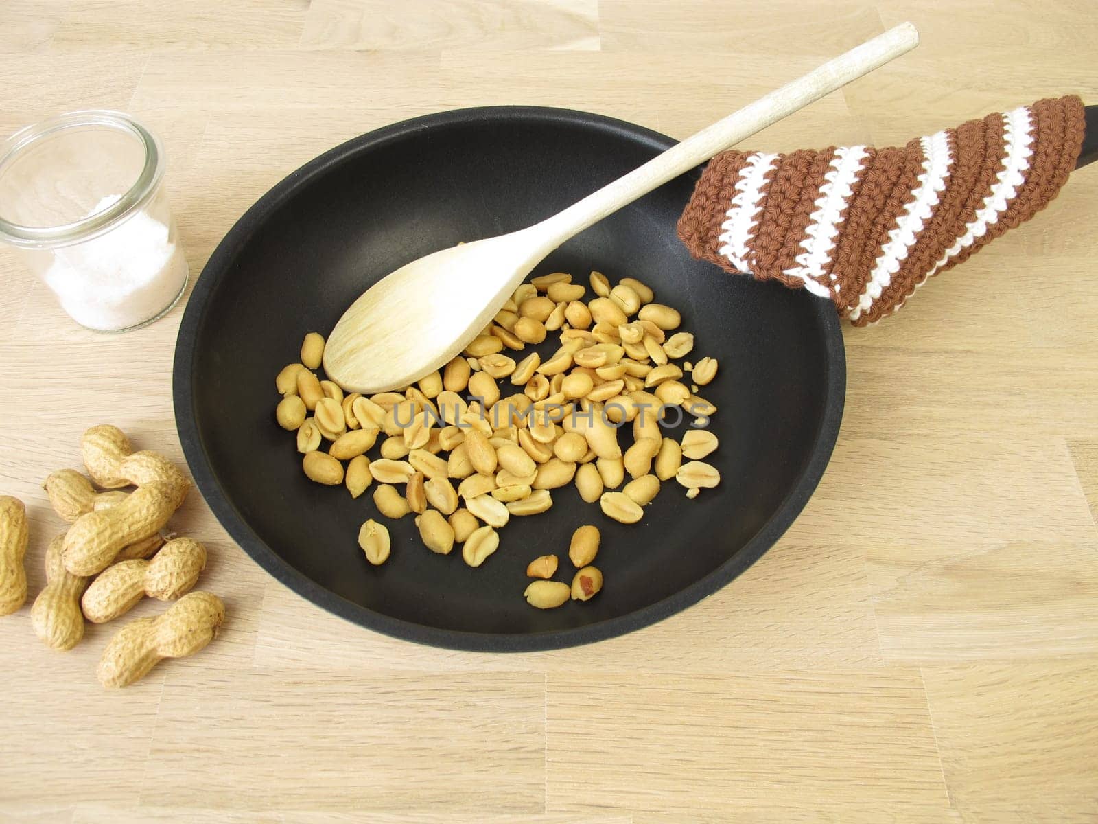 Peanuts roasted in a pan with salt