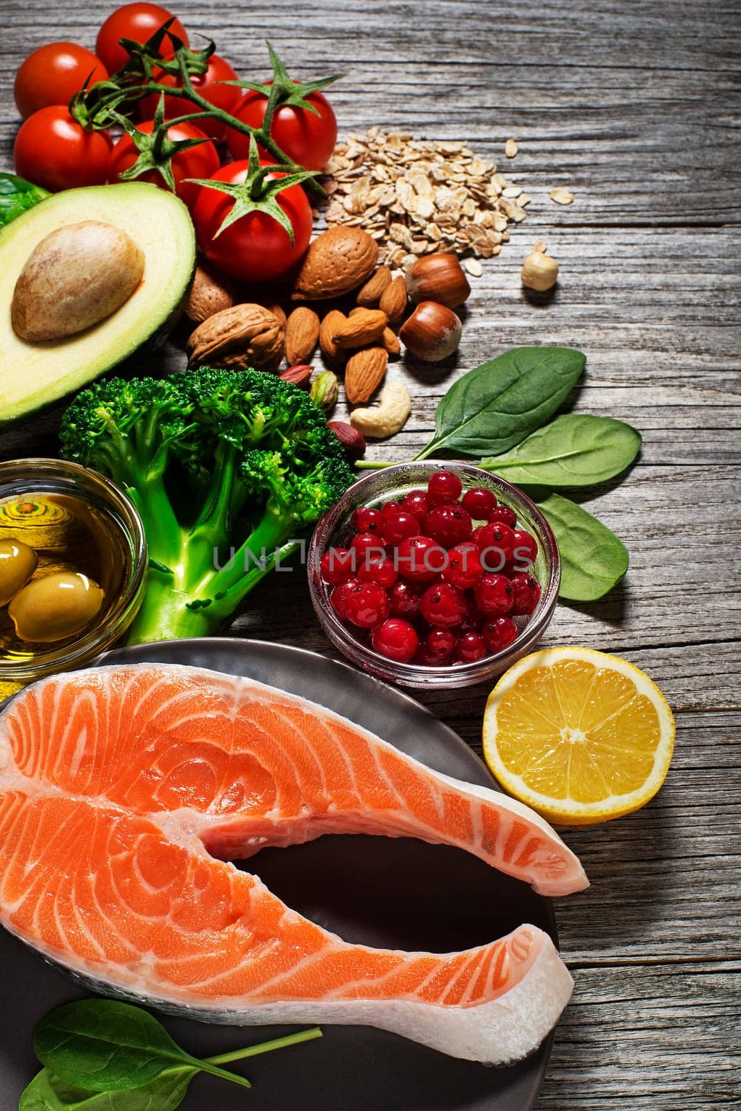 Mixed fresh healthy food with salmon fish- heart concept