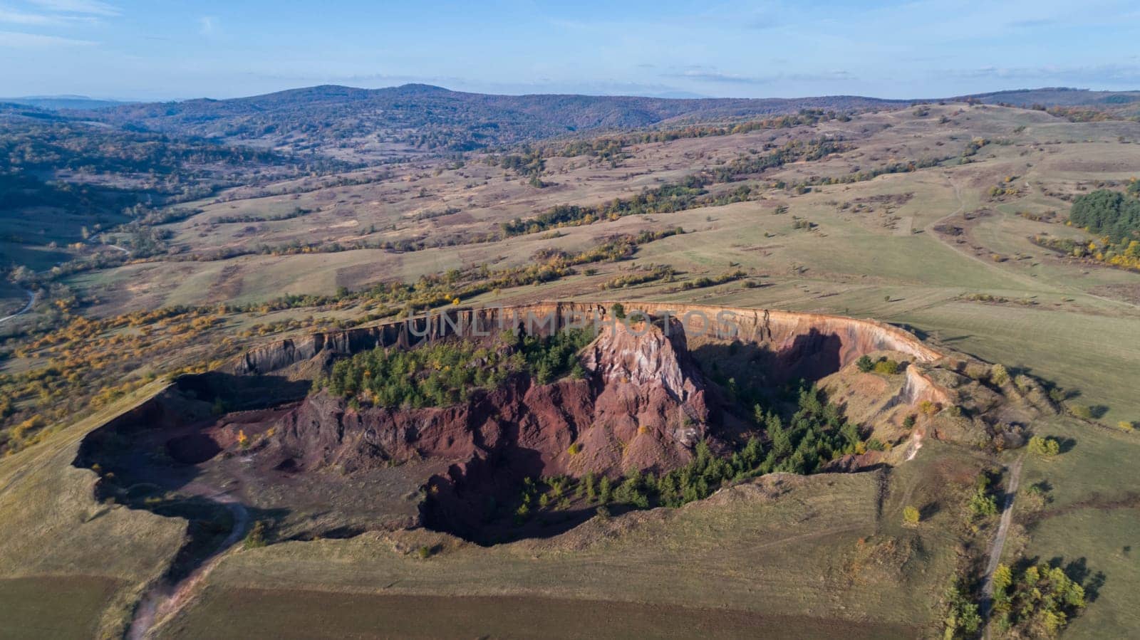 volcanic crater in Racos village. Brasov county, Transylvania, Romania. Aerial view