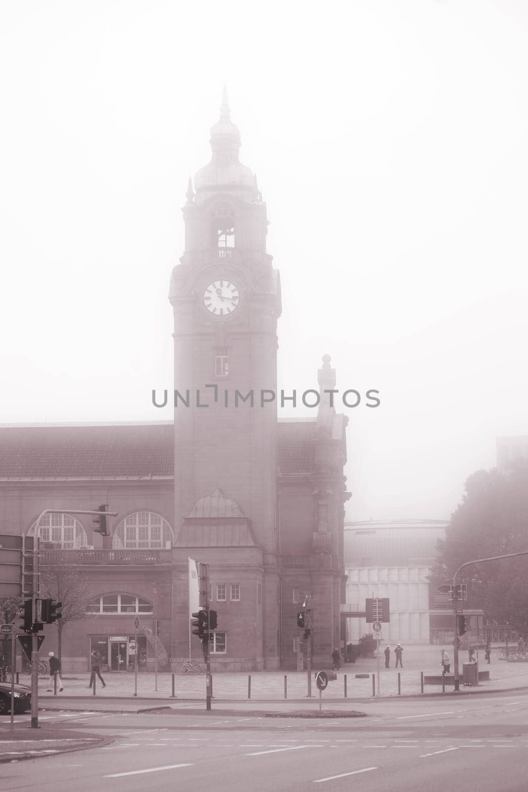 Wiesbaden,Germany - October 15,2017: The historic building of Wiesbaden Central Station with a clock tower in the fog on October 15,2017 in Wiesbaden.
