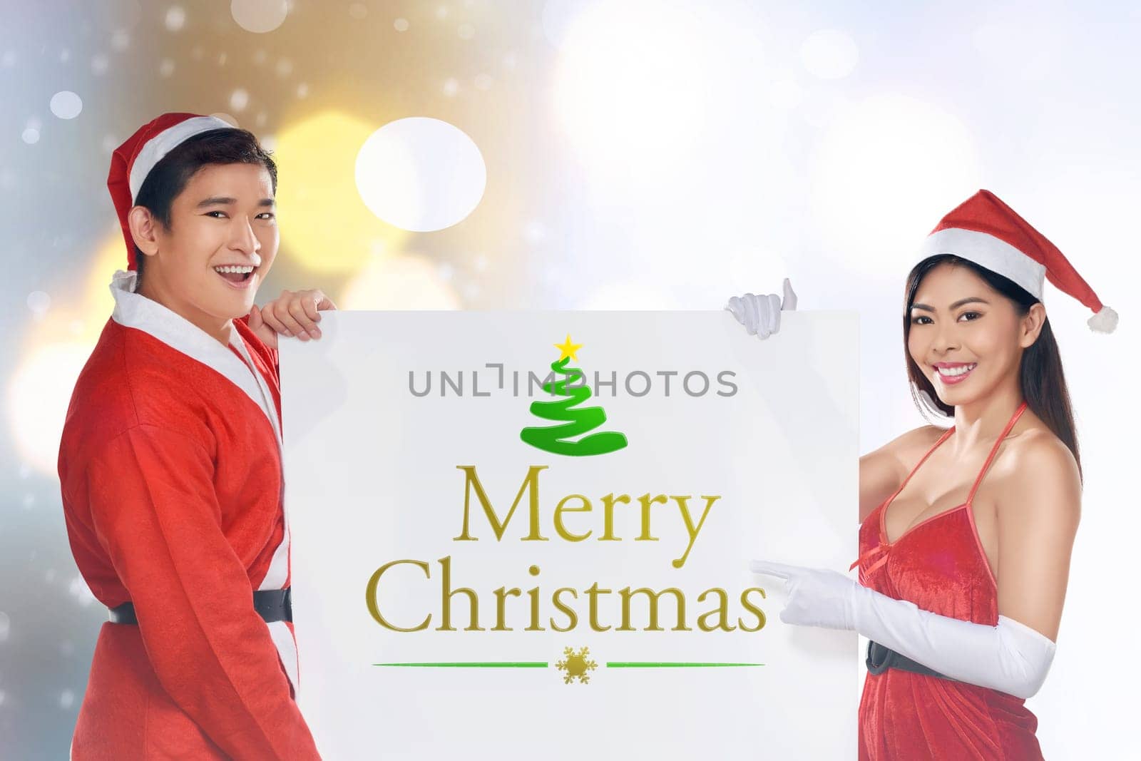 Asian couple wearing santa costume holding banner. Merry christmas concept