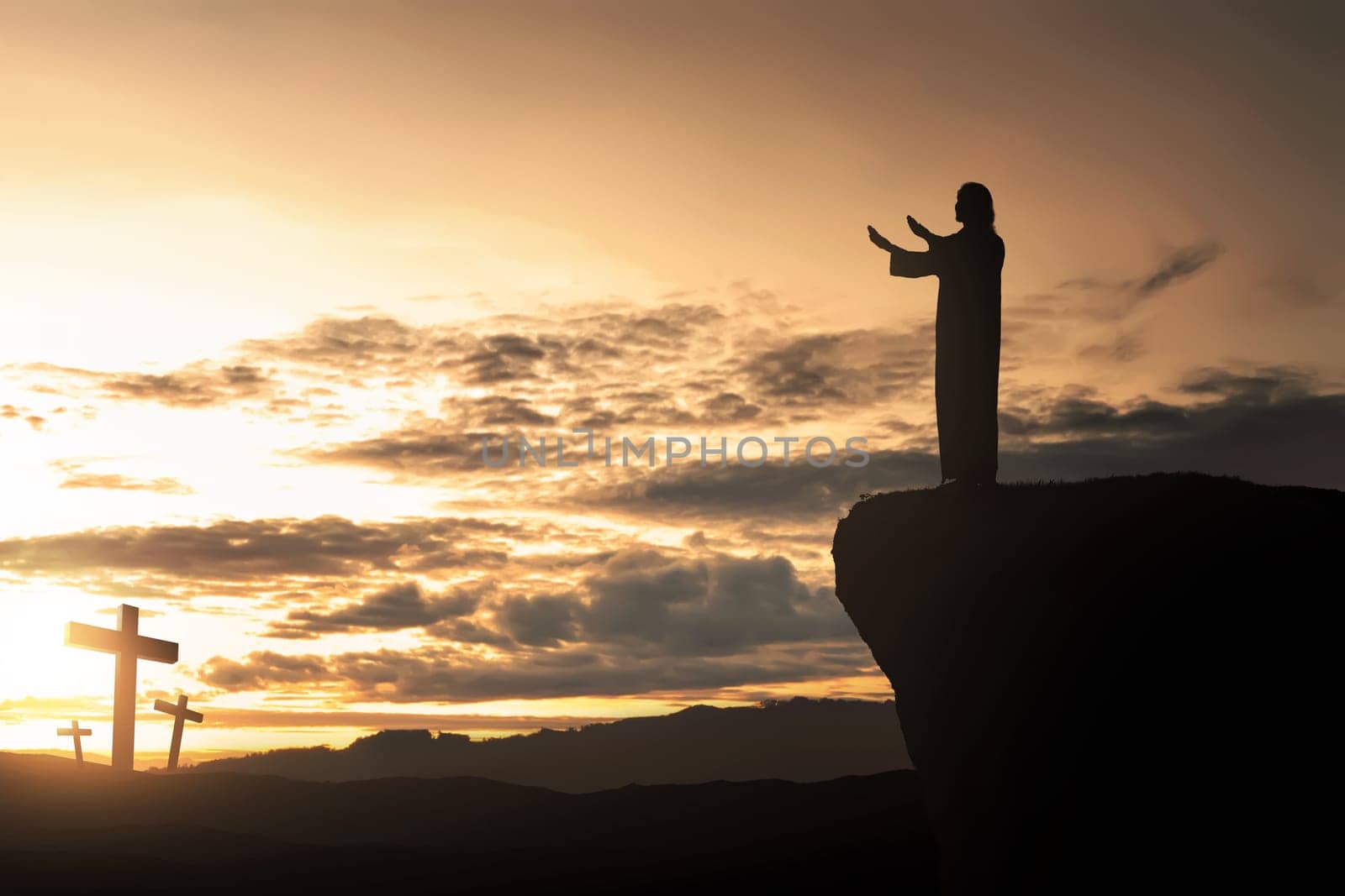 Silhouette of man facing the cross and praying with sunset background