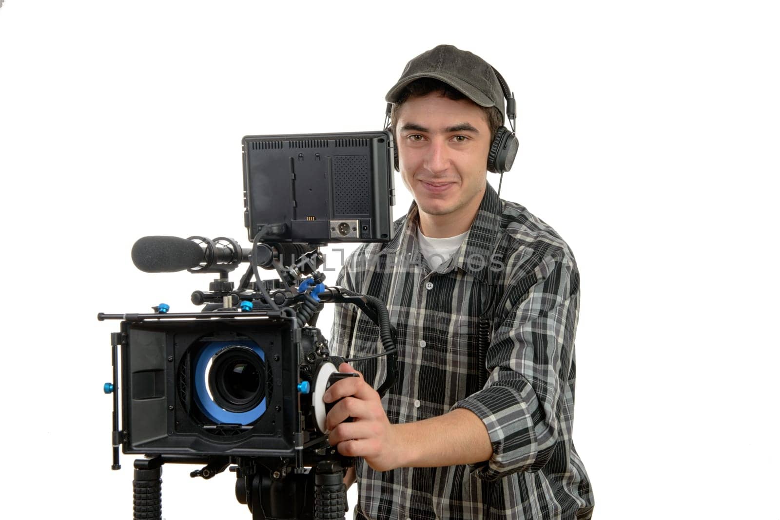 young cameraman with movie camera on the white background