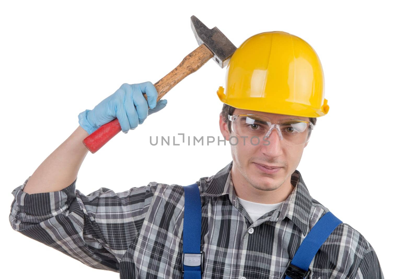 young worker with a hammer on the white background