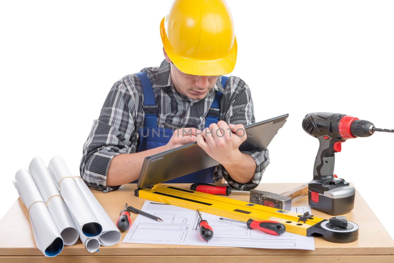 a young worker with a tablet in his office