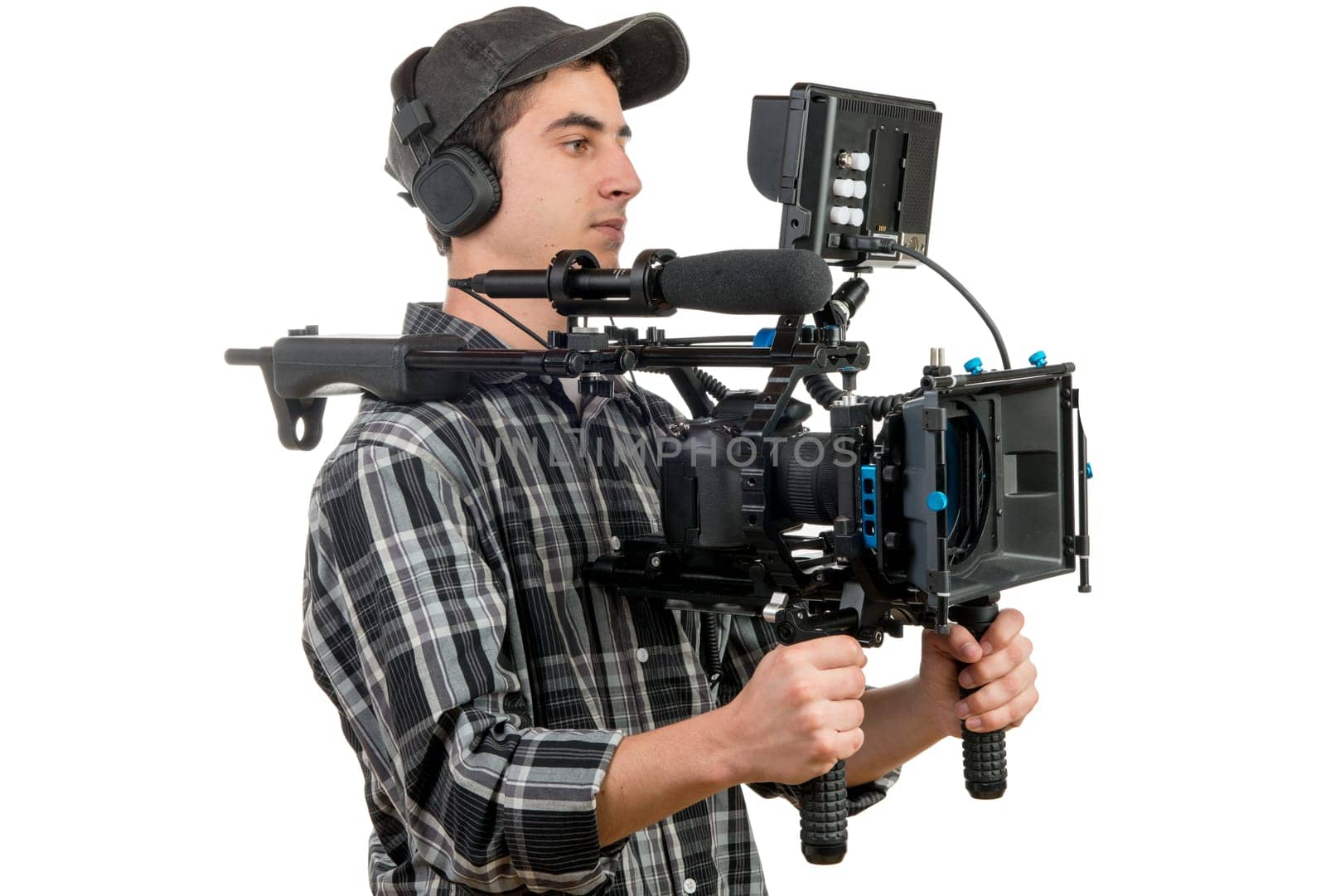 young cameraman with movie camera on the white background