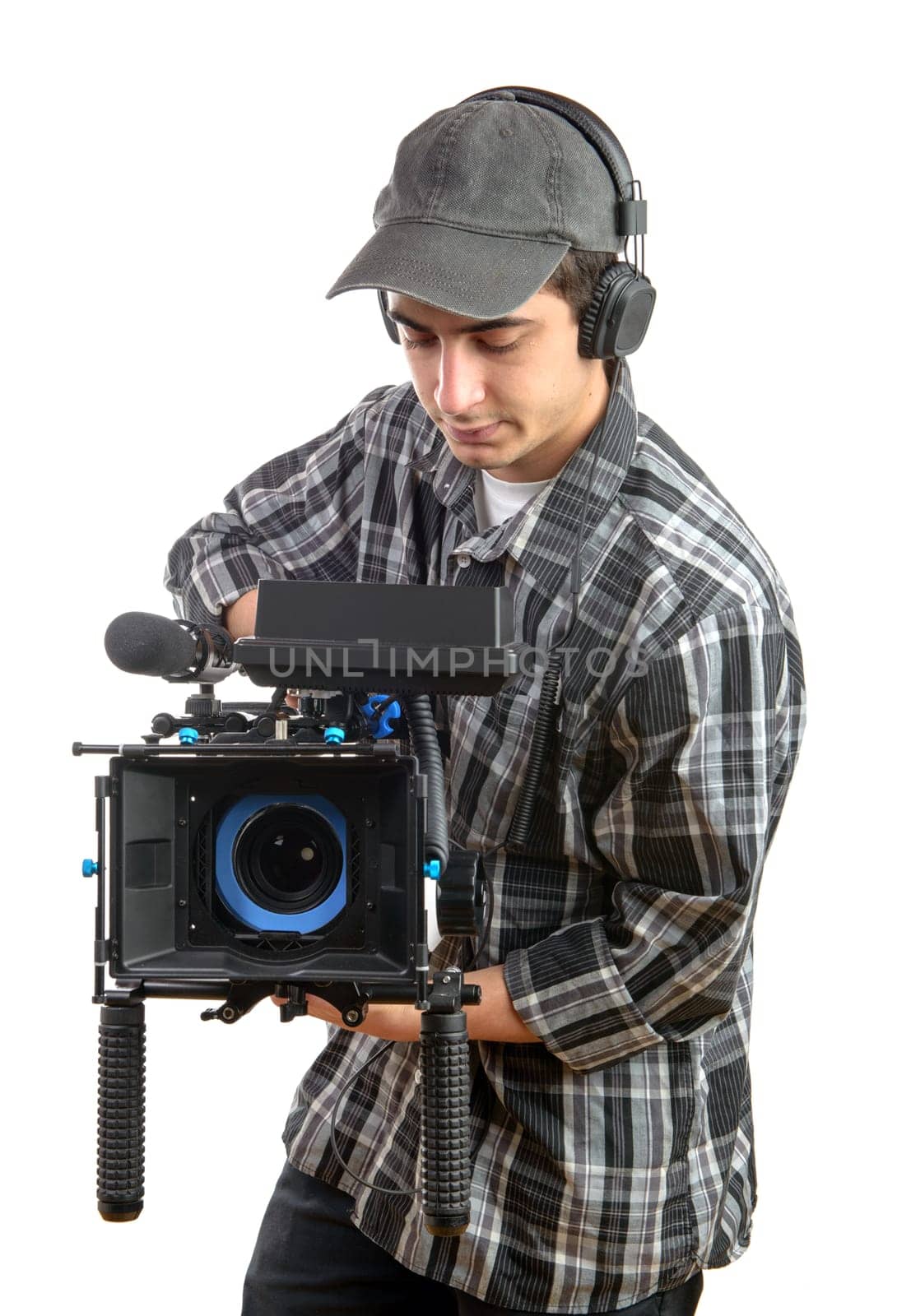 young cameraman with movie camera on the white background
