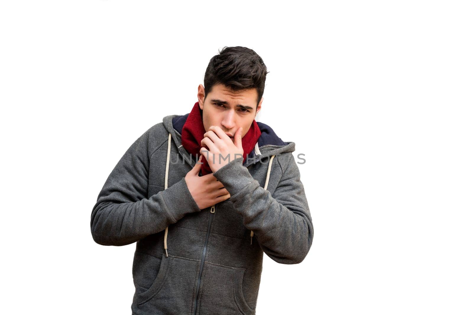 Young man sick with flu or cold, coughing with hand in front of his mouth, isolated on white