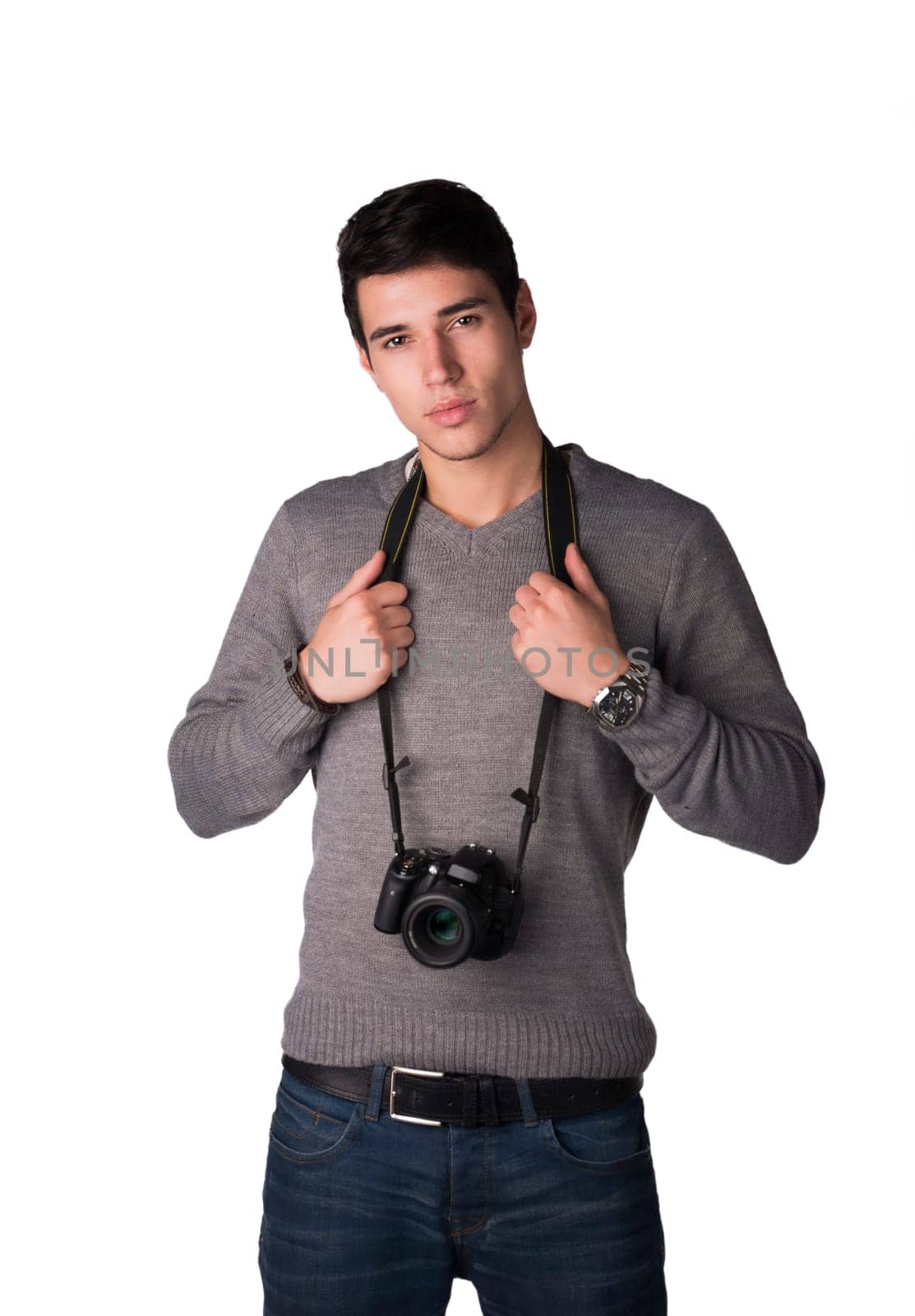Handsome young man with professional photo camera hanging from his neck, isolated on white