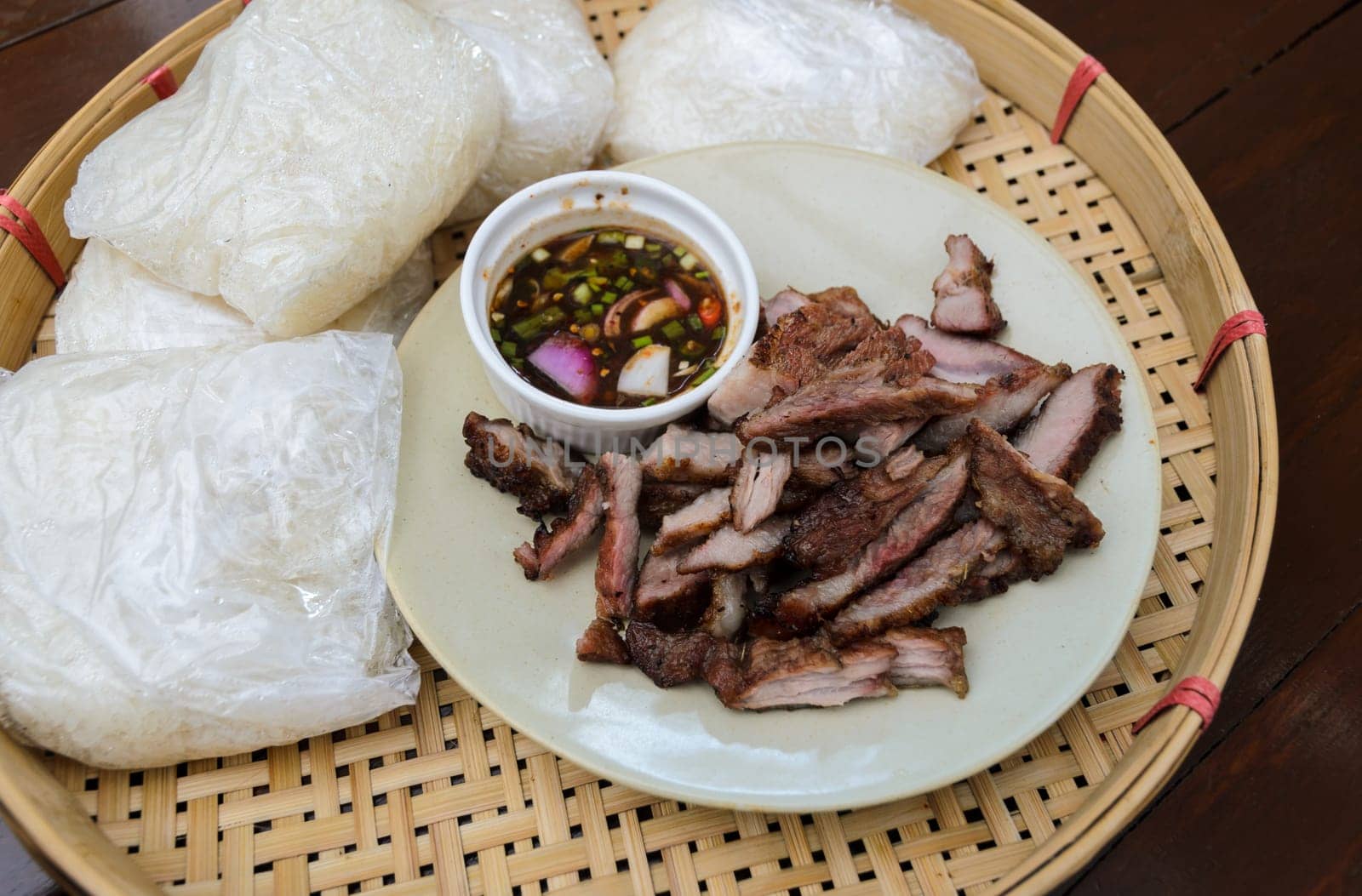 Thai slice grilled pork and Thai style sauce with sticky rice