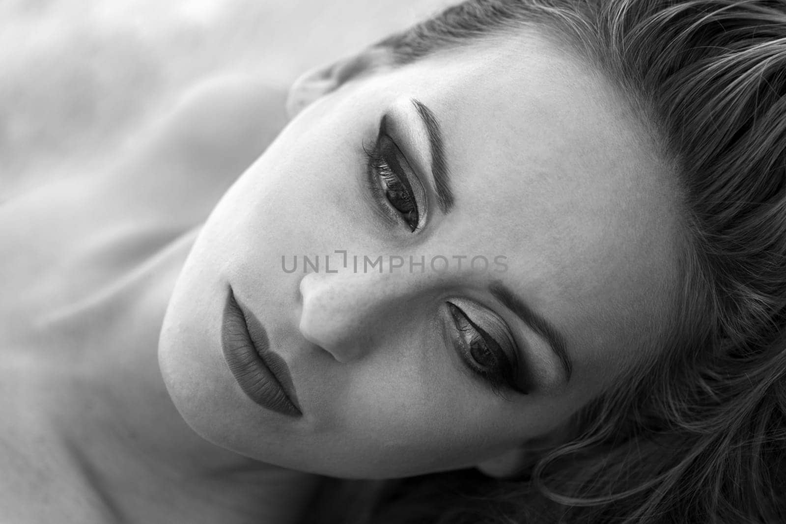Black & white beauty portrait of a woman with make-up.