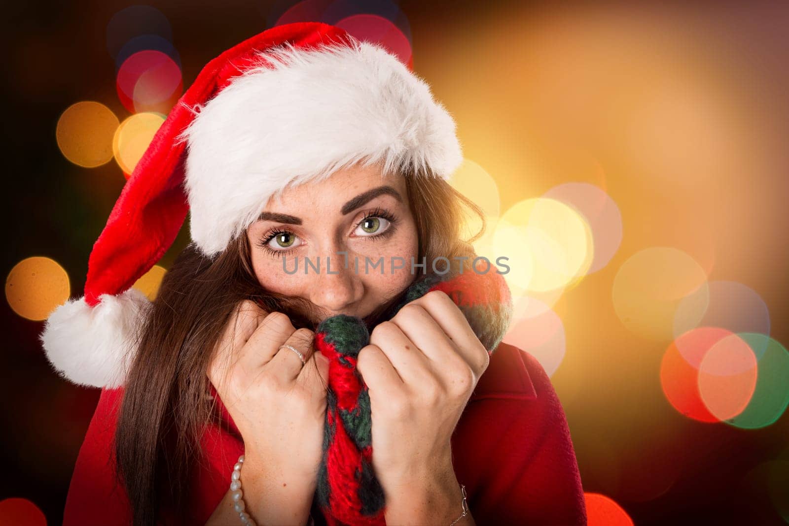 Happy and beautiful girl with freckles in Christmas background