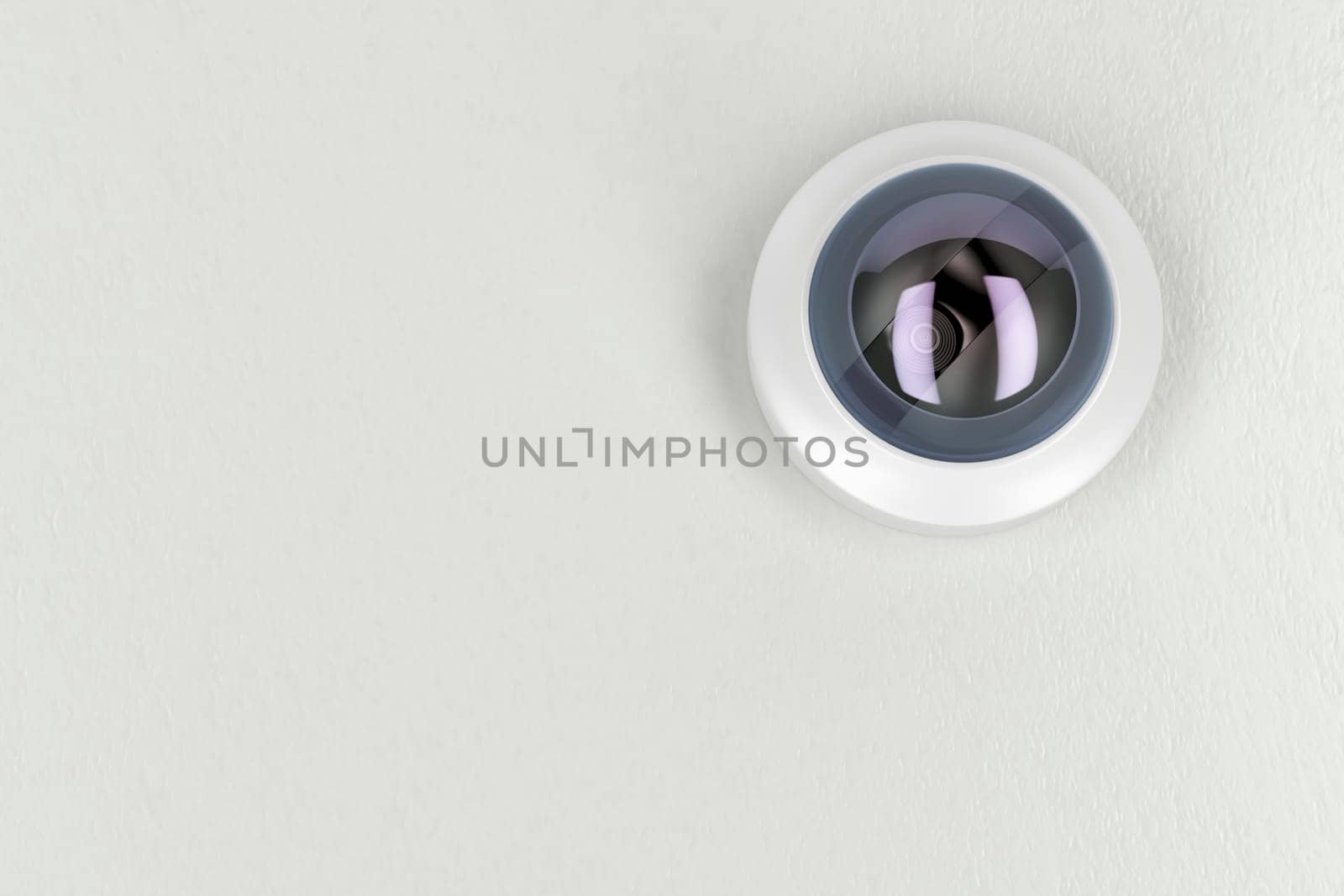 Bottom view of cctv camera on white ceiling