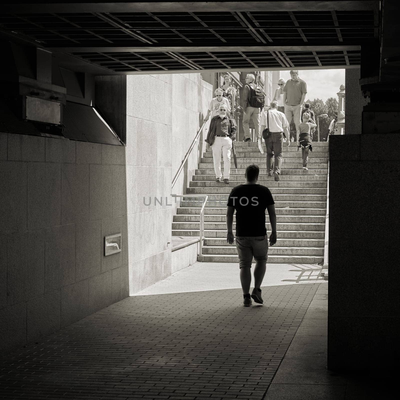 Tourists under the Rathausbrücke in the Nikolaiviertel in Berlin-Mitte
