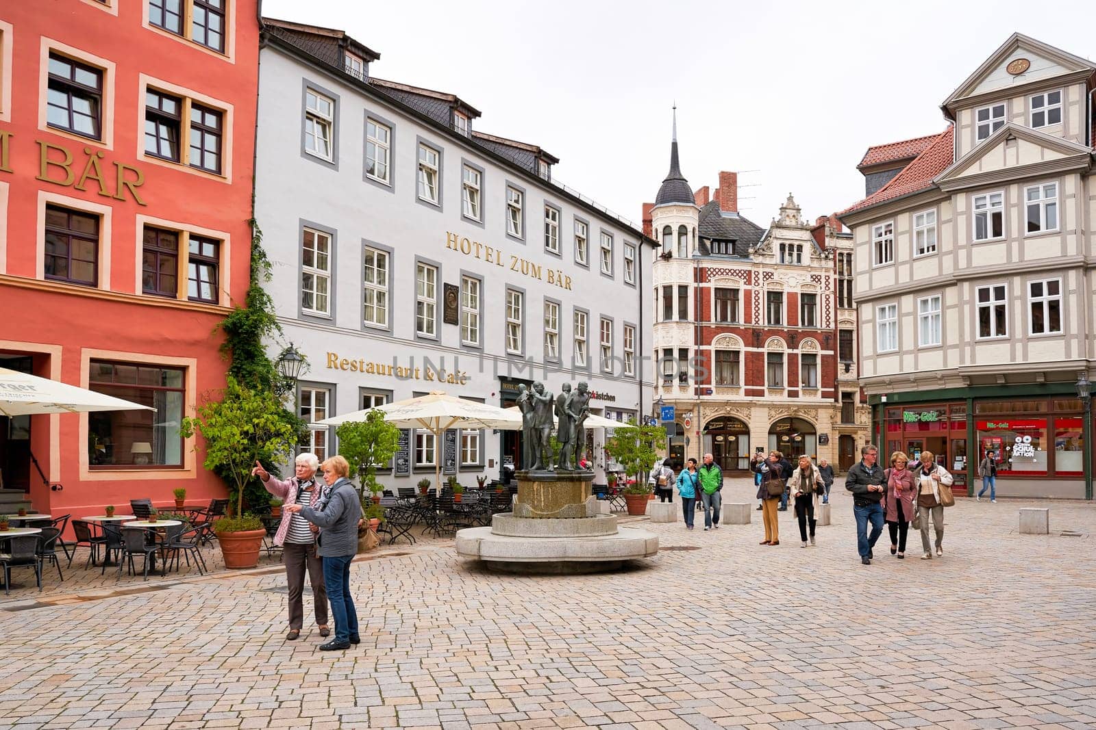 Tourists on the historic market square in the old town of Quedlinburg in the Harz Mountains