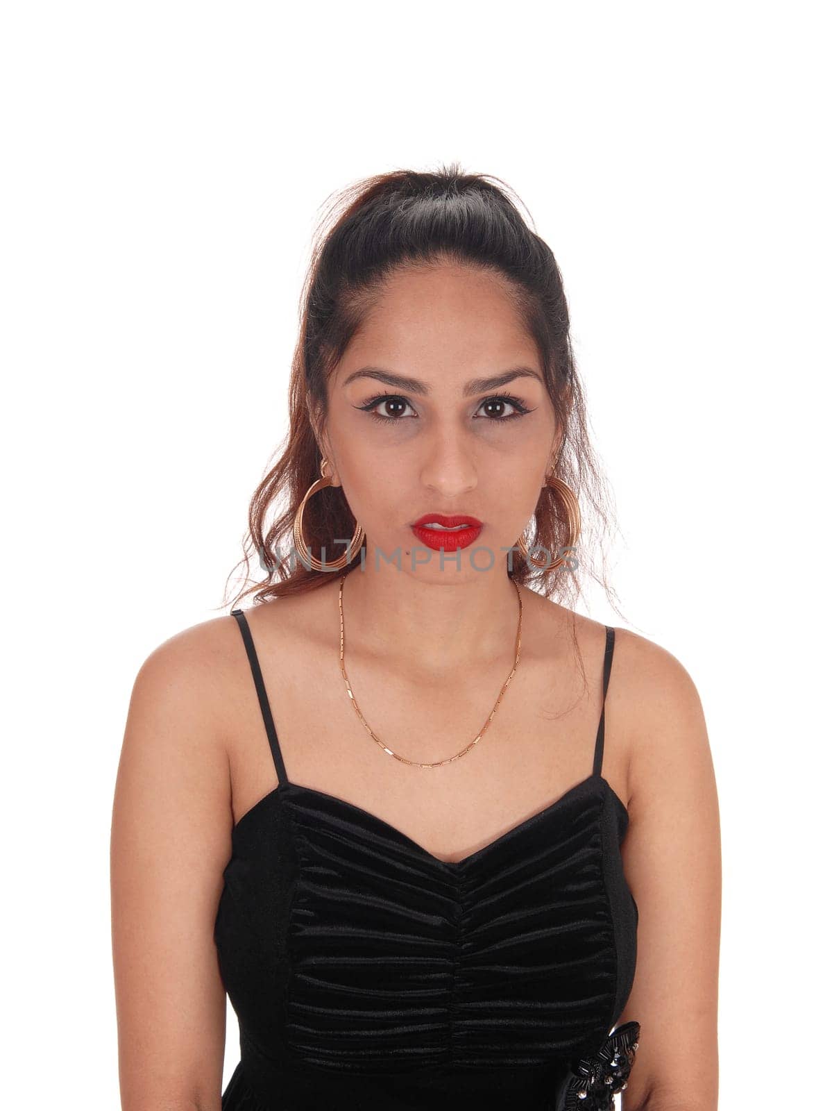 A closeup portrait image of a brunette woman in a black dress and.earrings and necklace, isolated for white background.