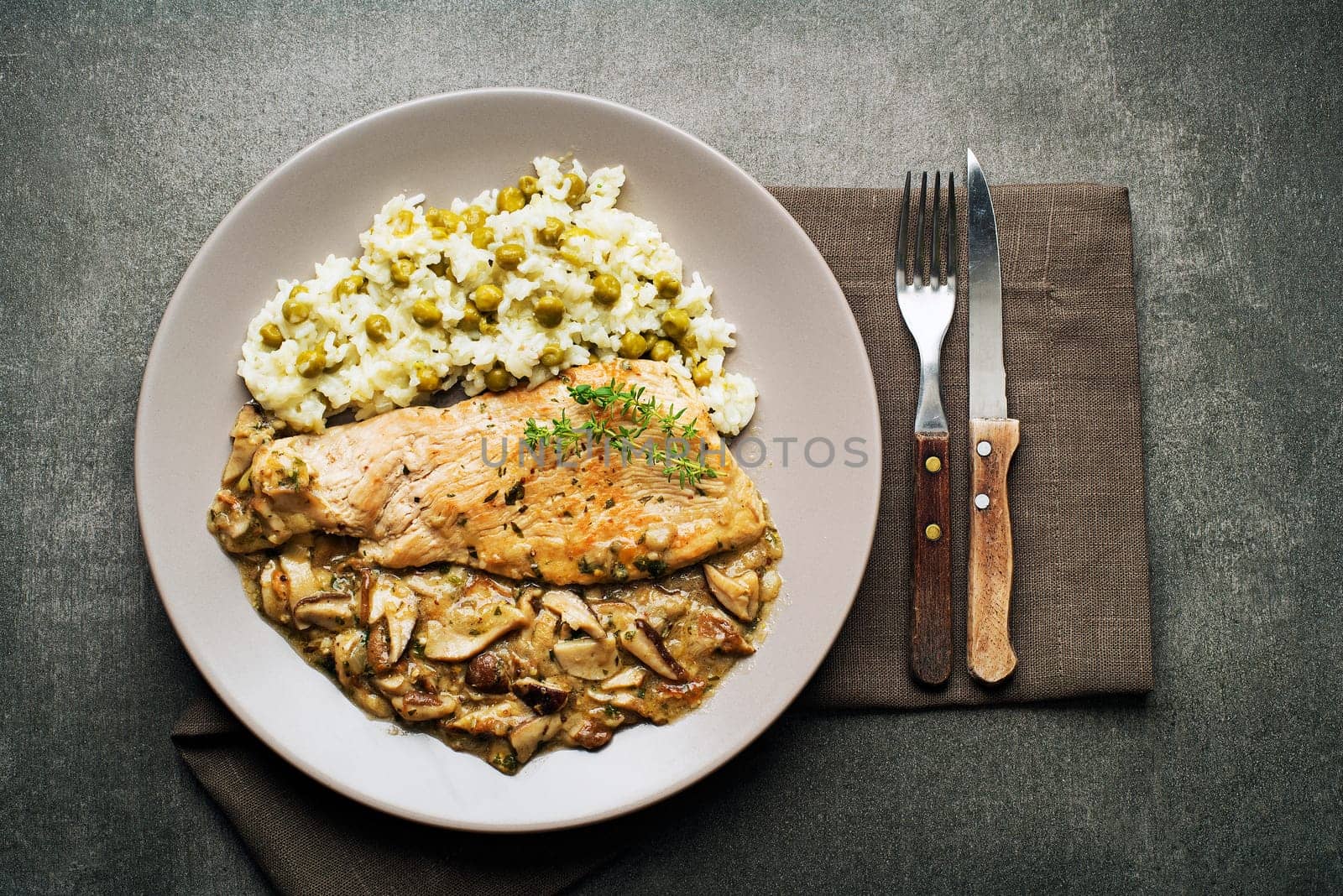 Roasted chicken steak with stir fry mushroom sauce and rice with pea
