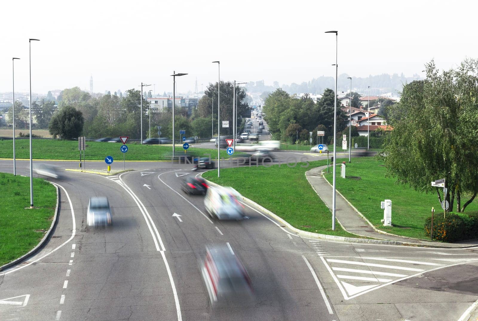 Traffic in the city, jam, flowing with blurred motion.