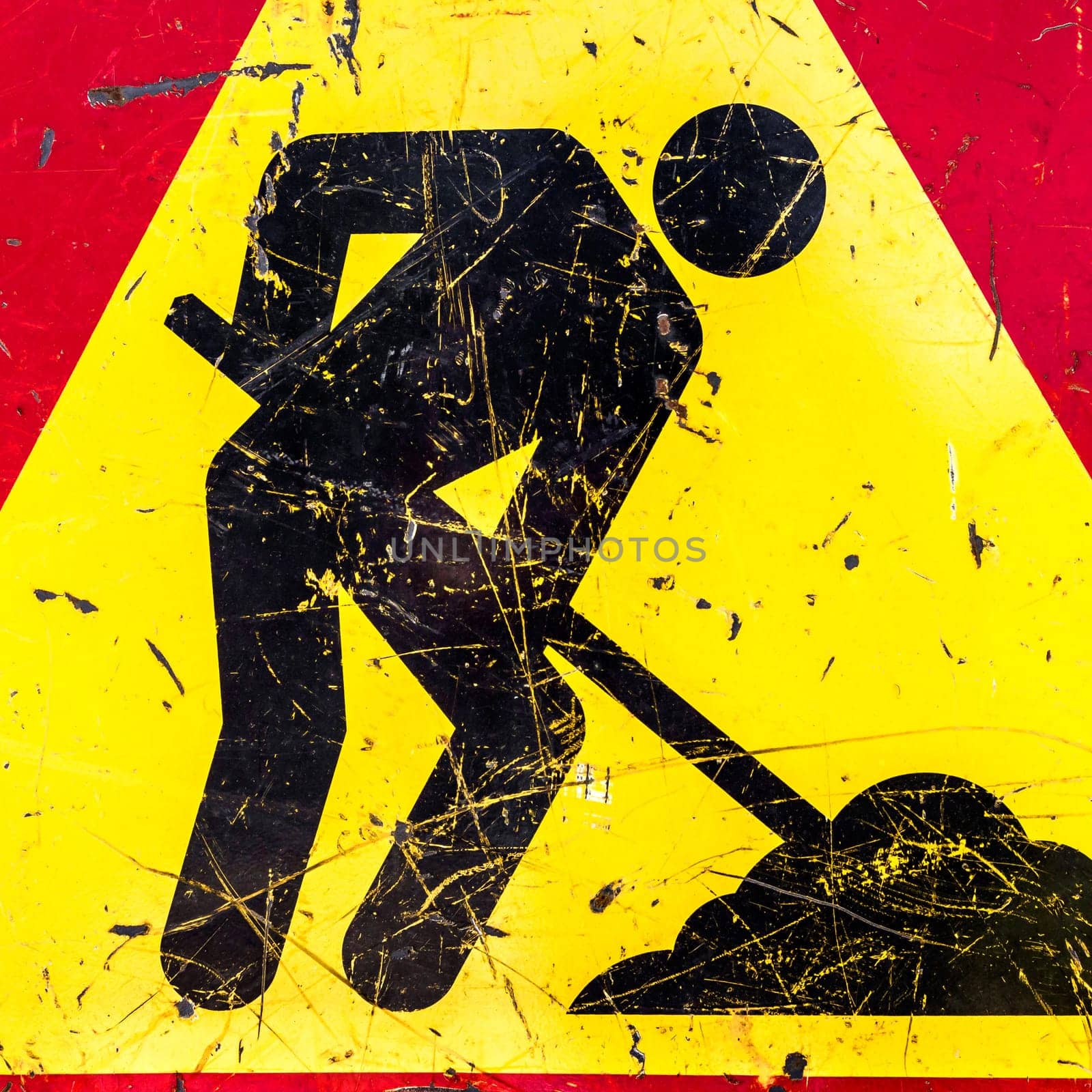 One sign of attention, road works. The sign is old, worn out.