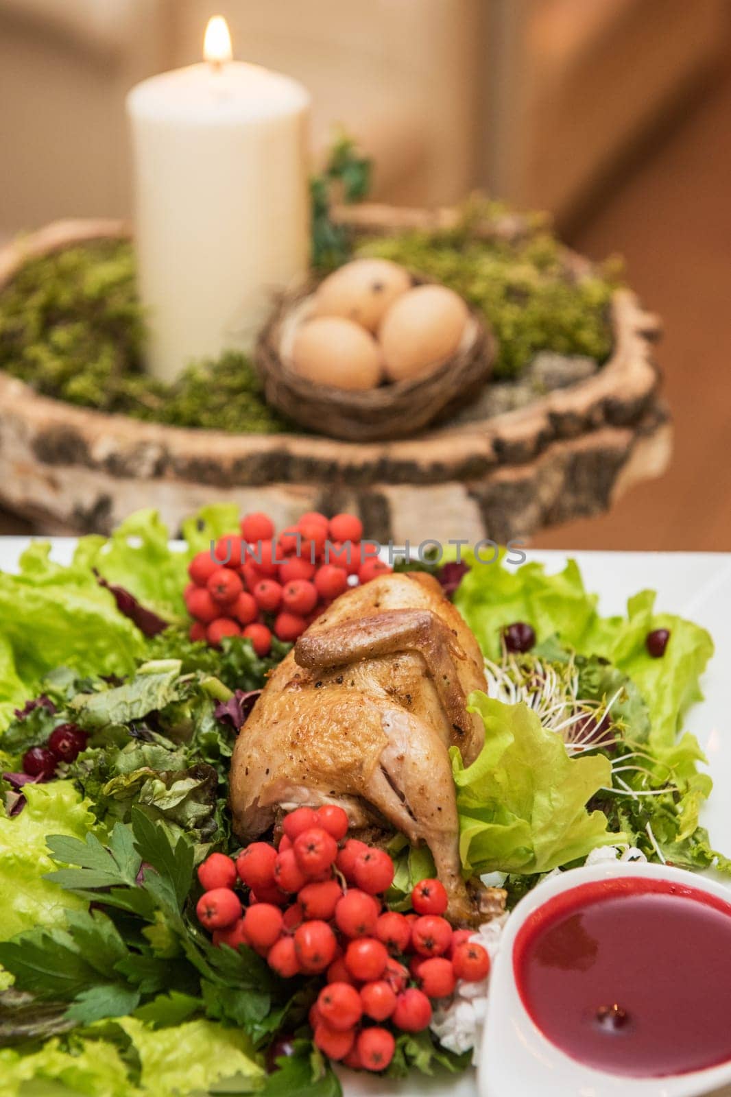 quail roasted with sweet and sour cranberry sauce decorated with rowanberry