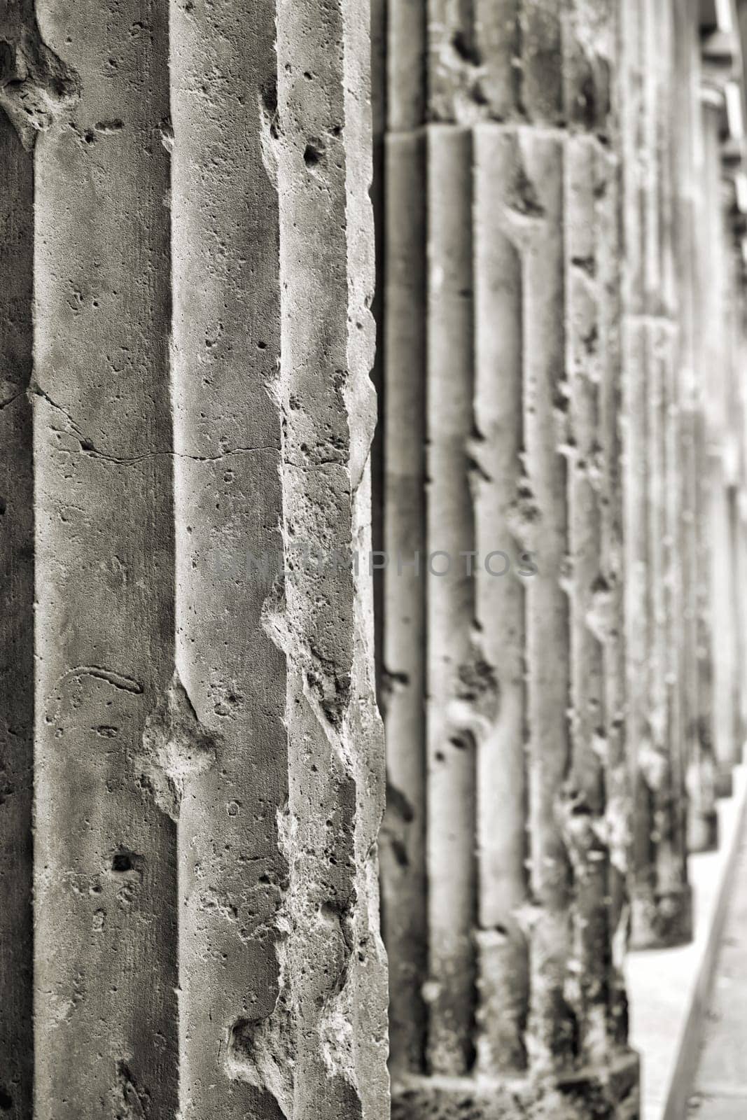 old damaged sandstone columns on a building in Berlin