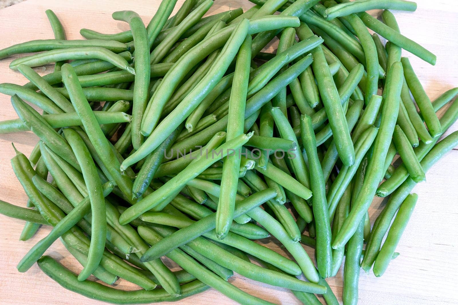 Green String Beans on Chopping Board in Kitchen Closeup Macro