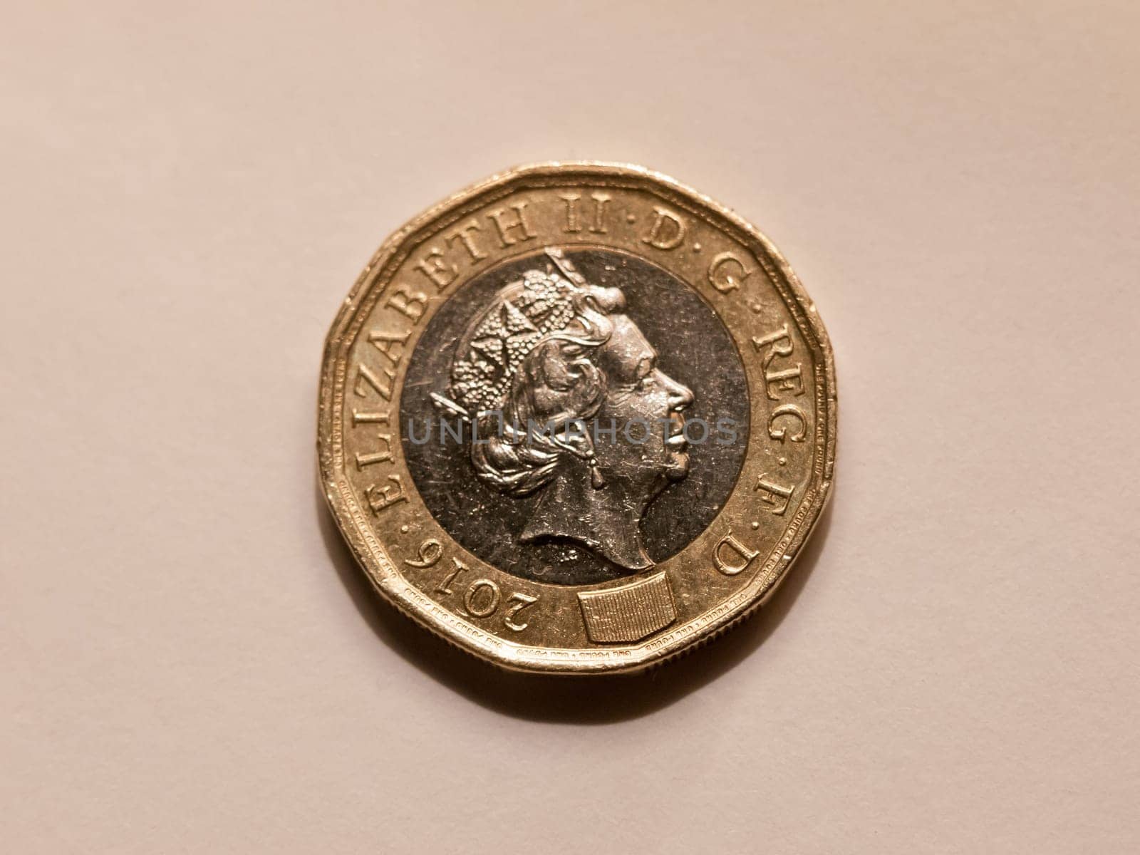 close up of brand new one pound coin uk sterling queen's head  essex  england  uk