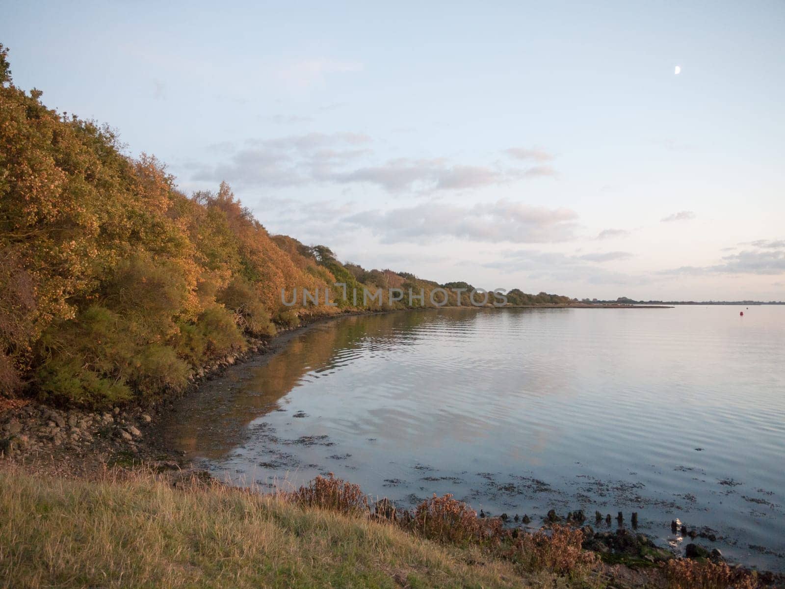 beautiful evening bay scene outside water wave ripples empty open space harbour country  essex  england  uk