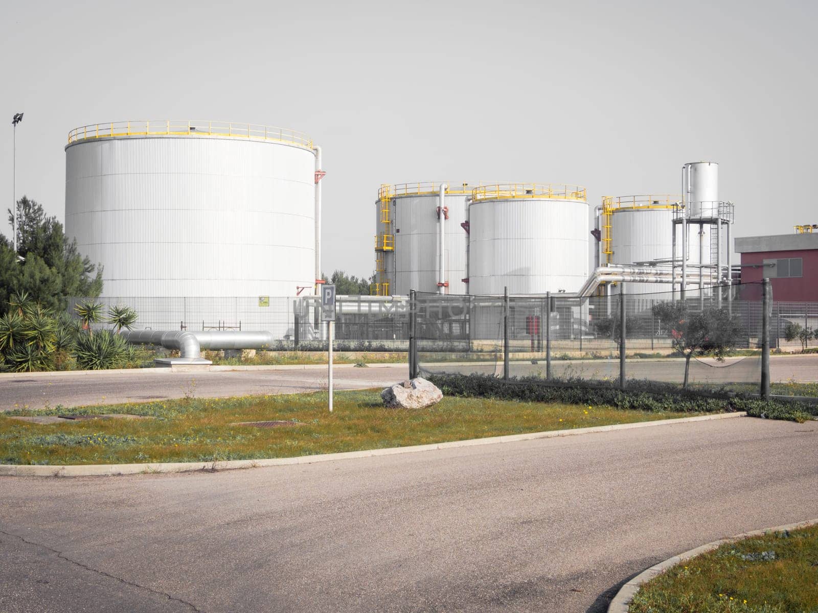white industrial tanks in the industrial port of Oristano