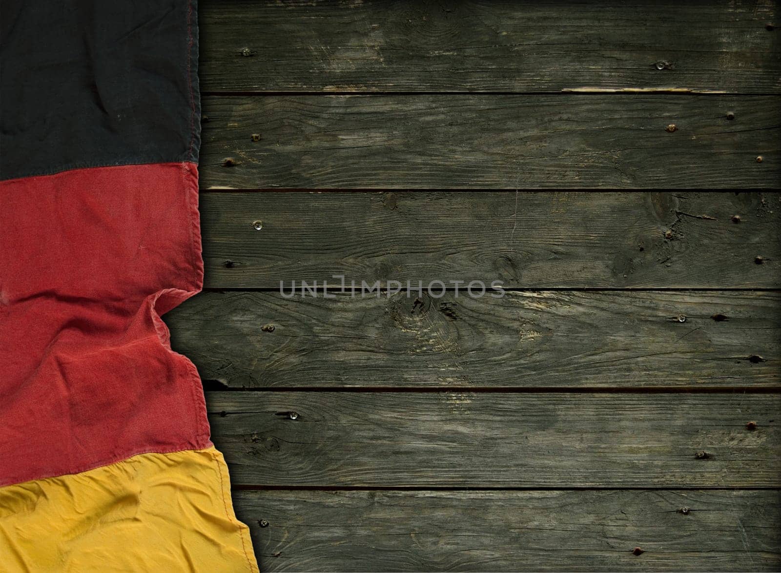 Flag of the Federal Republic of Germany on old wooden boards