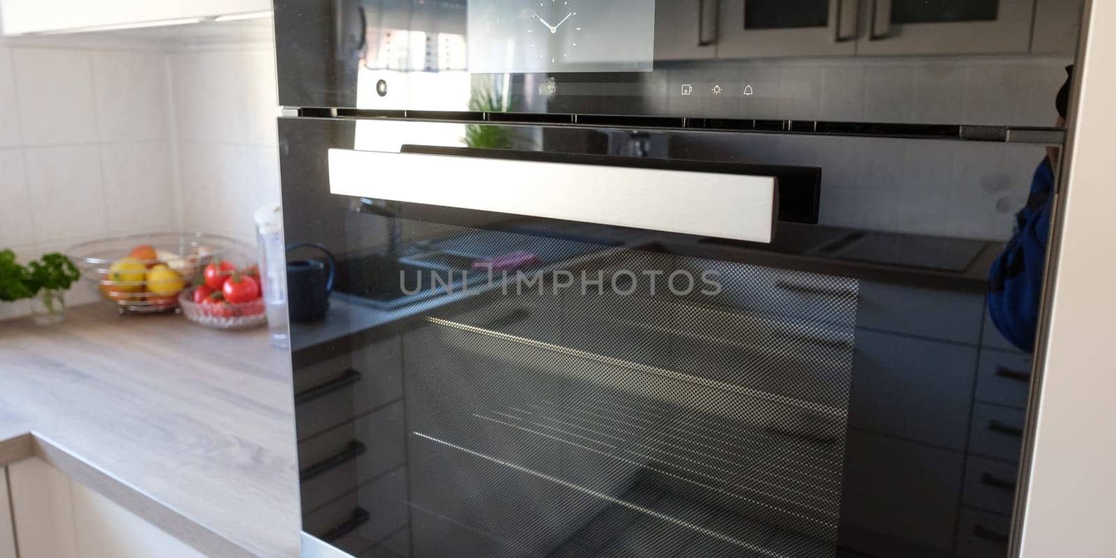 Oven with steamer in fitted kitchen and front made of glass