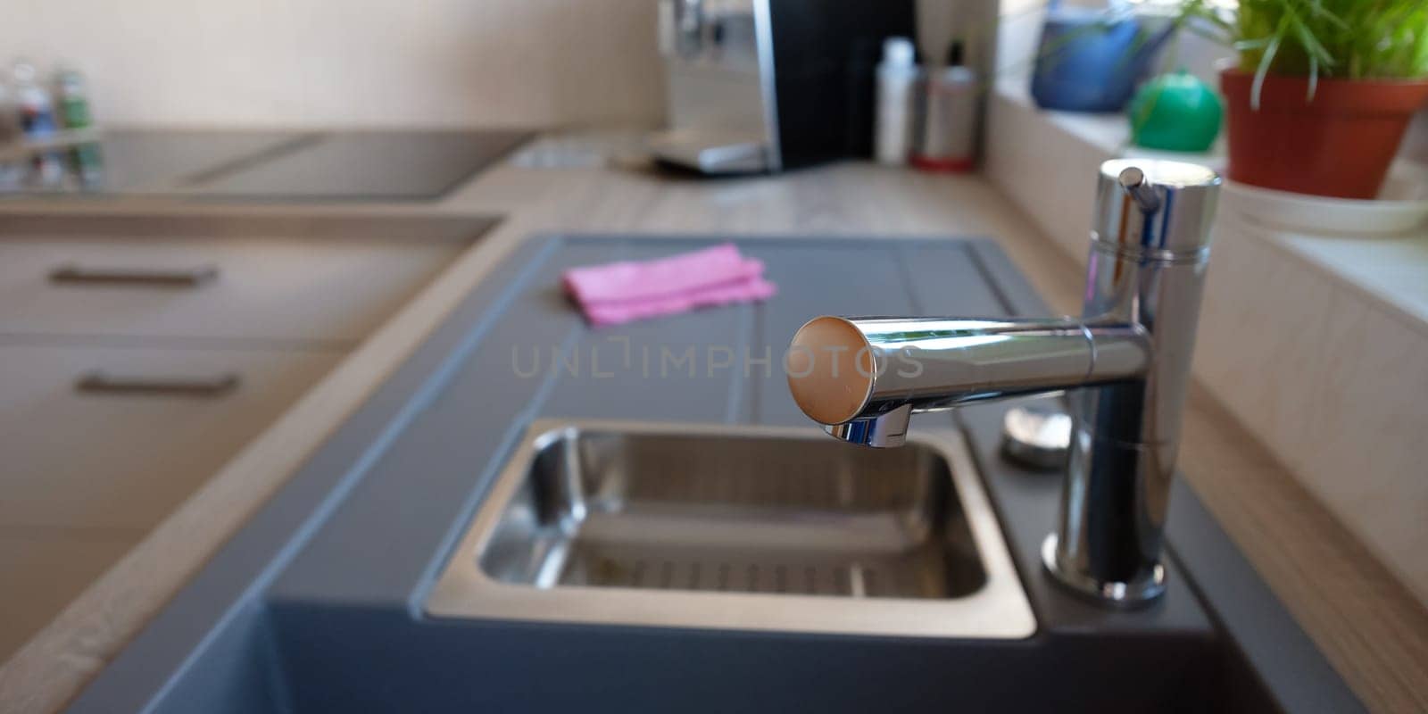 Faucet with mixer of a sink in kitchen made of stainless steel