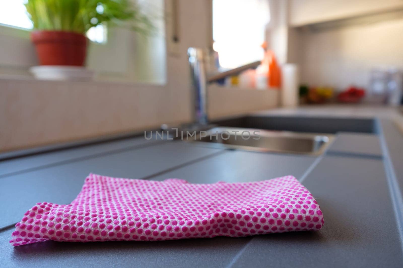 Dishcloth on a sink with blur in the background