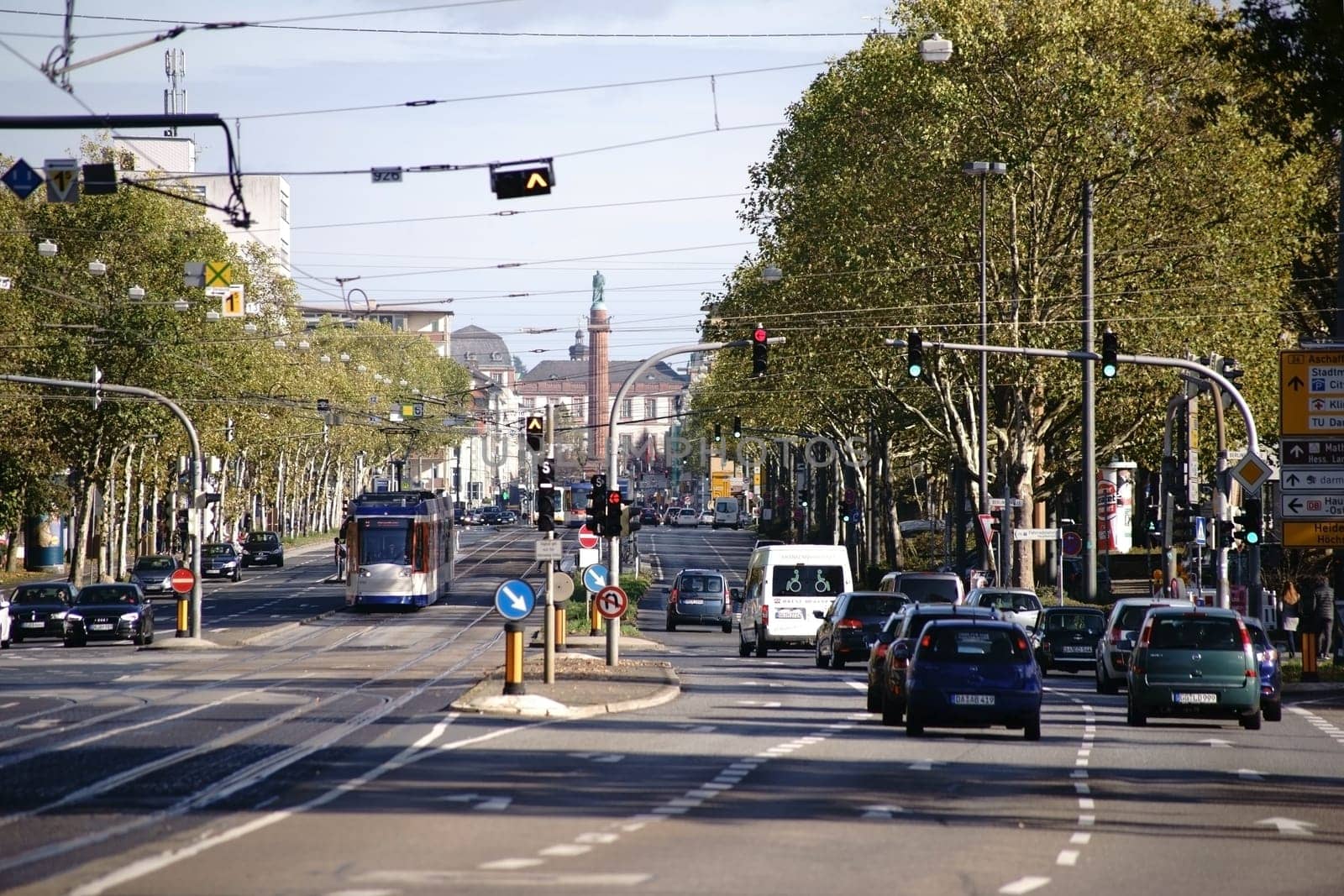 Darmstadt,Germany - October 31,2017: Busy road traffic on Rheinstraße with the Ludwigsmonument in the background on October 31,2017 in Darmstadt.