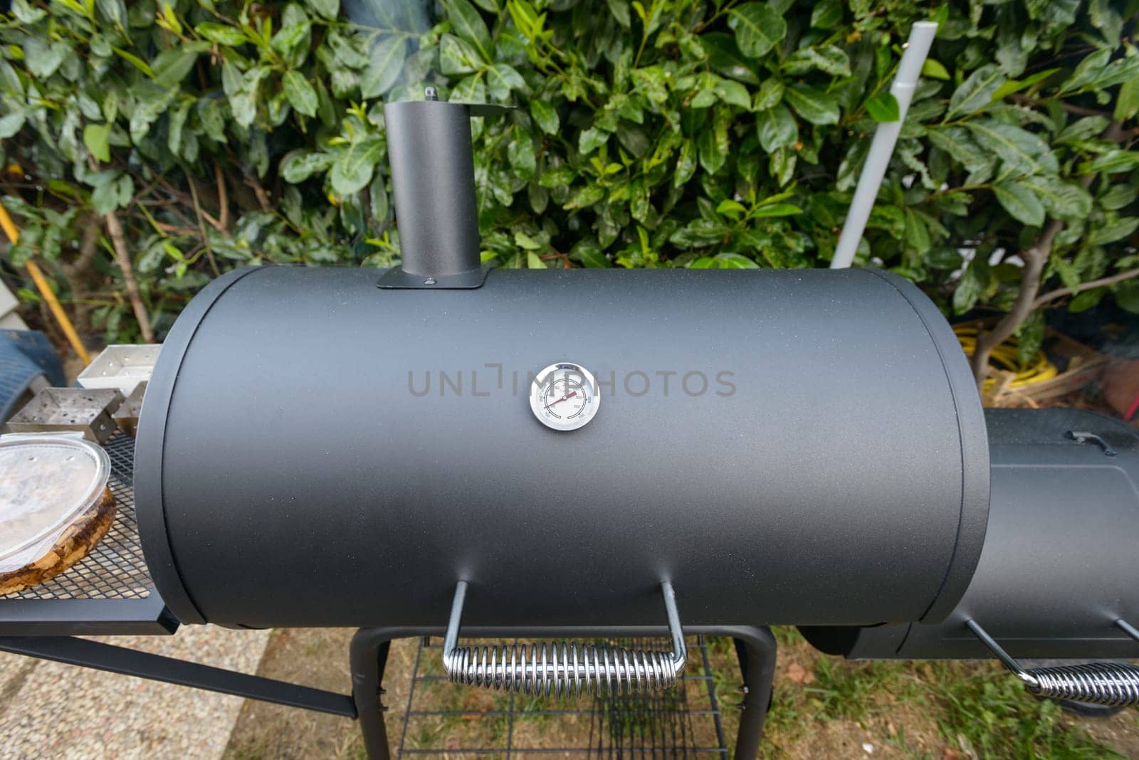 A black barbecue ready for grilling a slow cook pulled pork and ribs