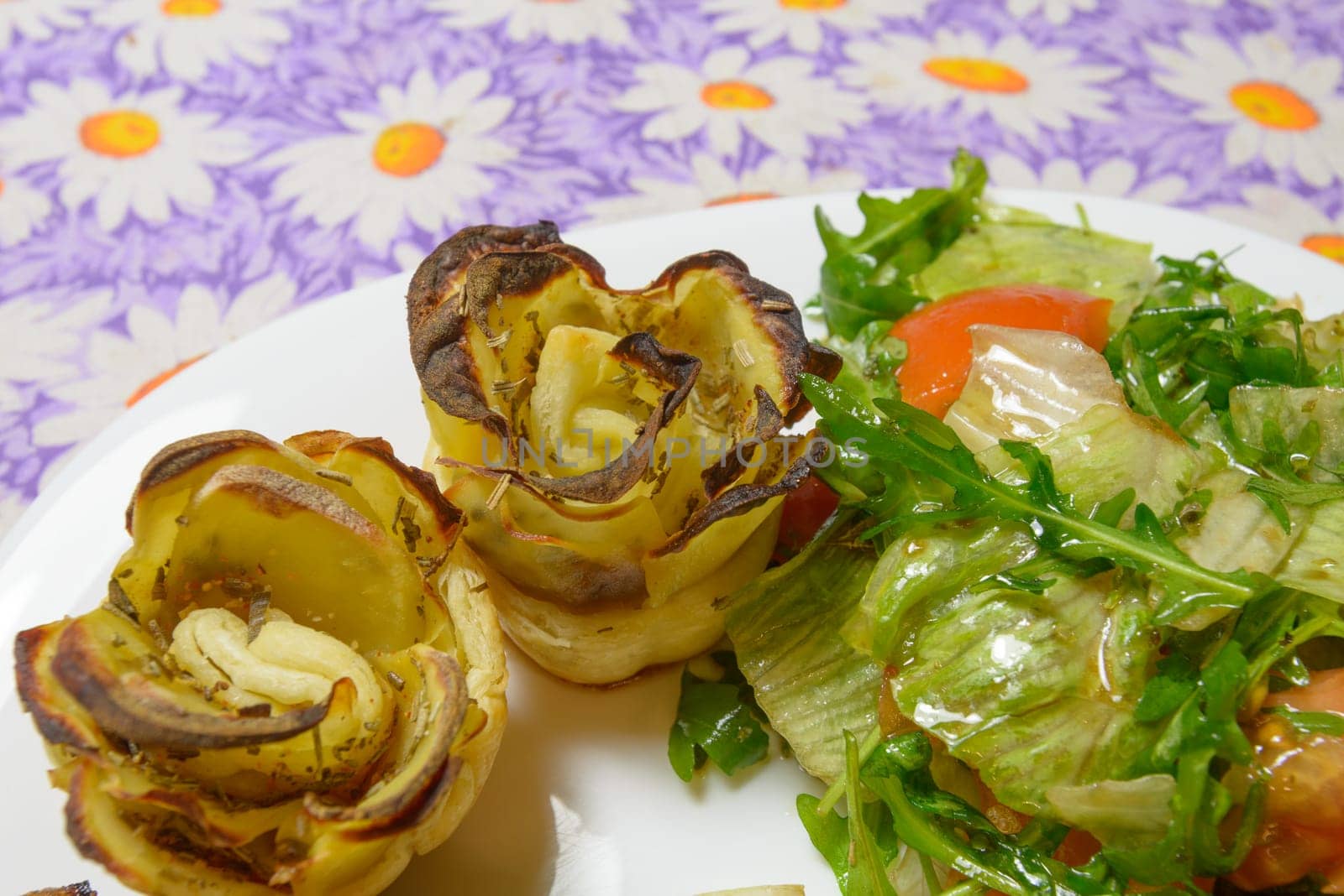 Italian style green salad and potatoes with tomatoes