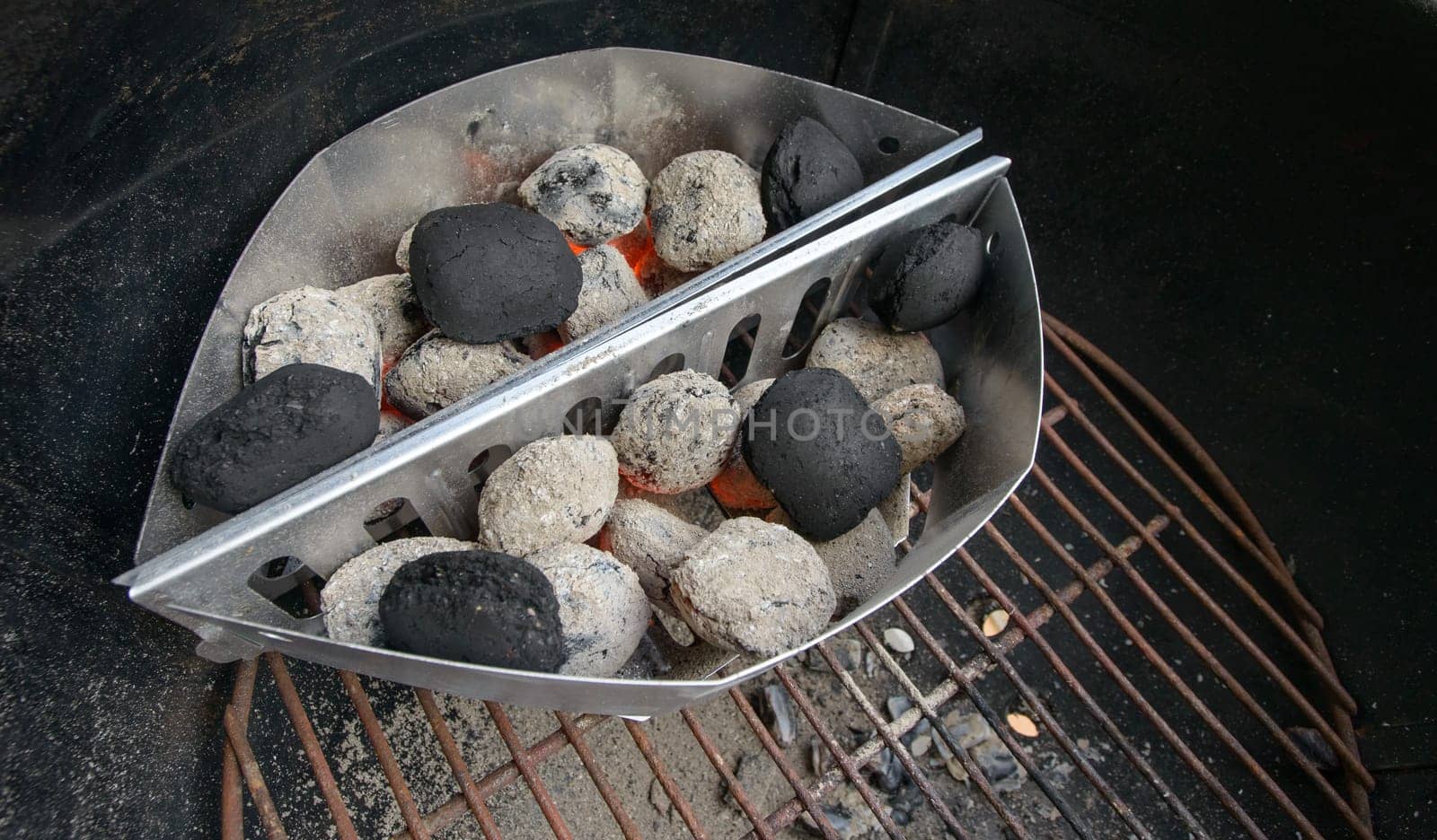 preparing briquette and barbecue for grilling meat