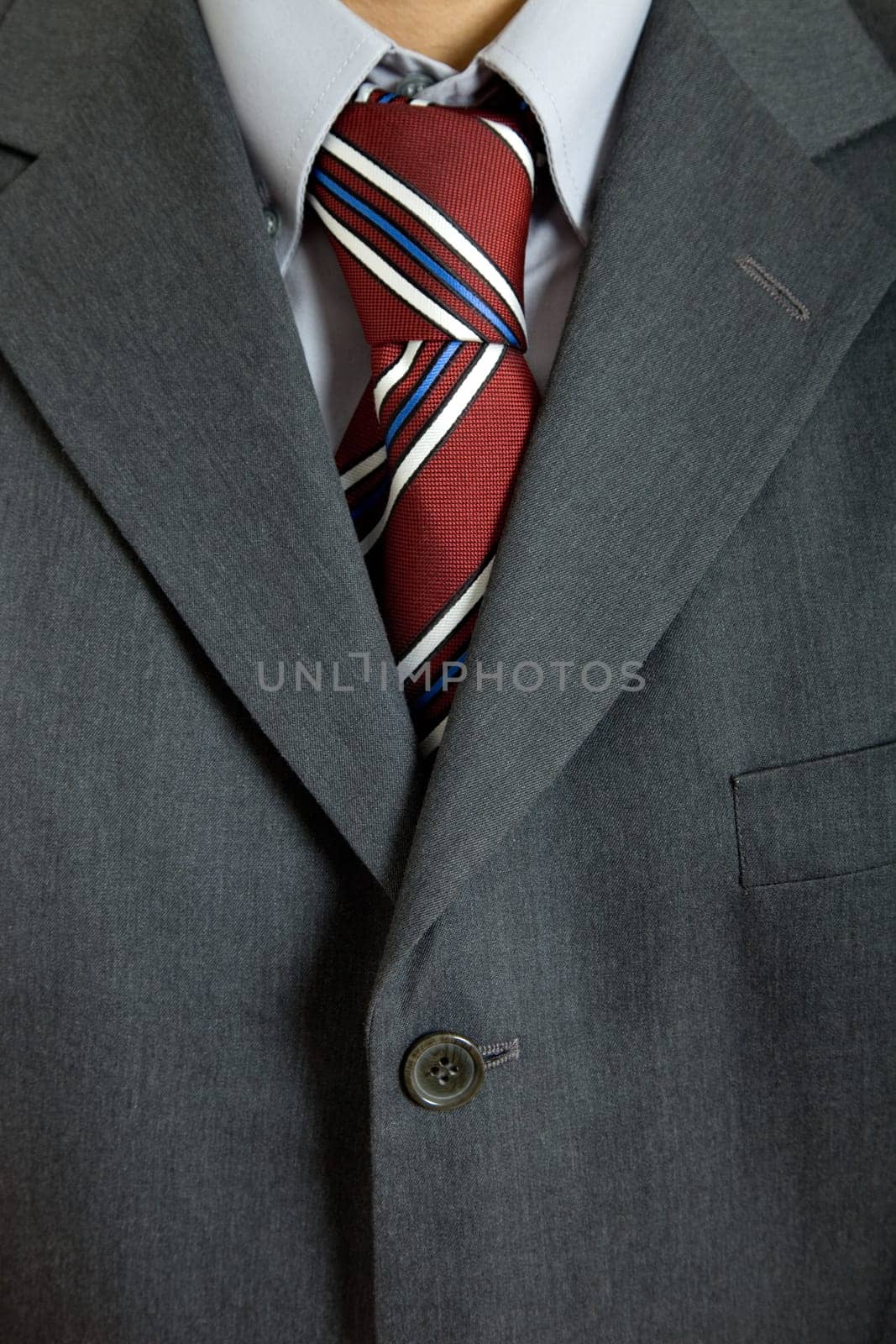detail of a business man suit with colored tie