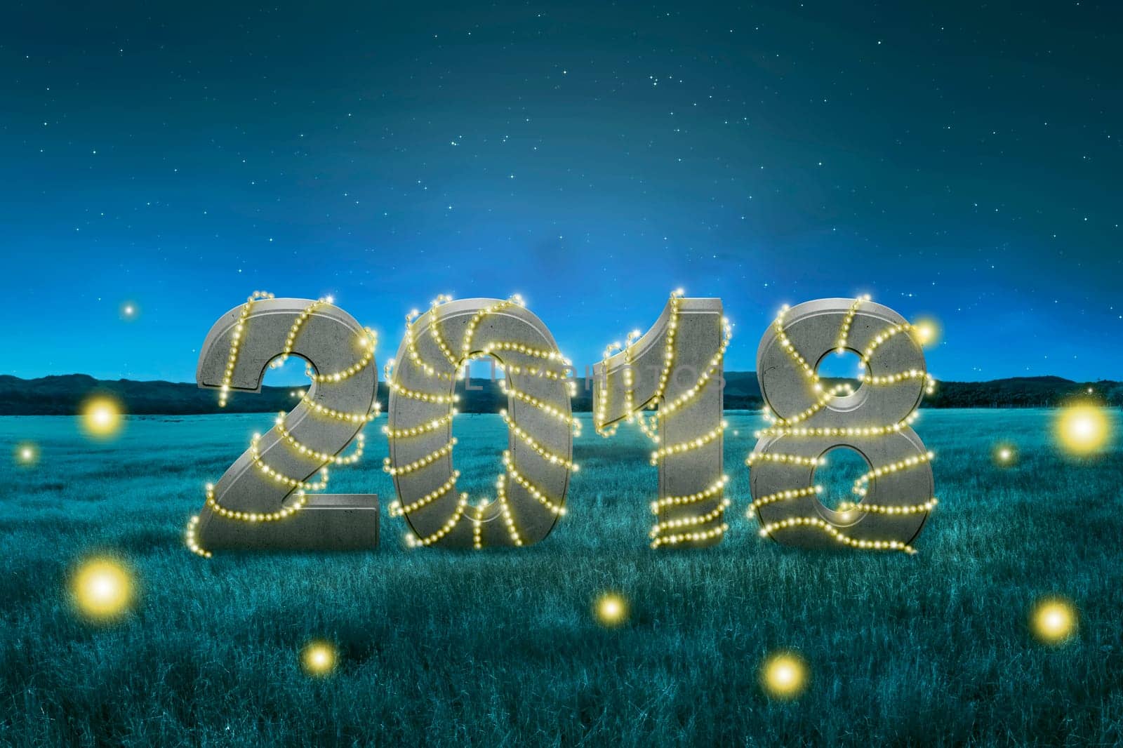 2018 number with christmas light decoration on the field. Happy New Year 2018