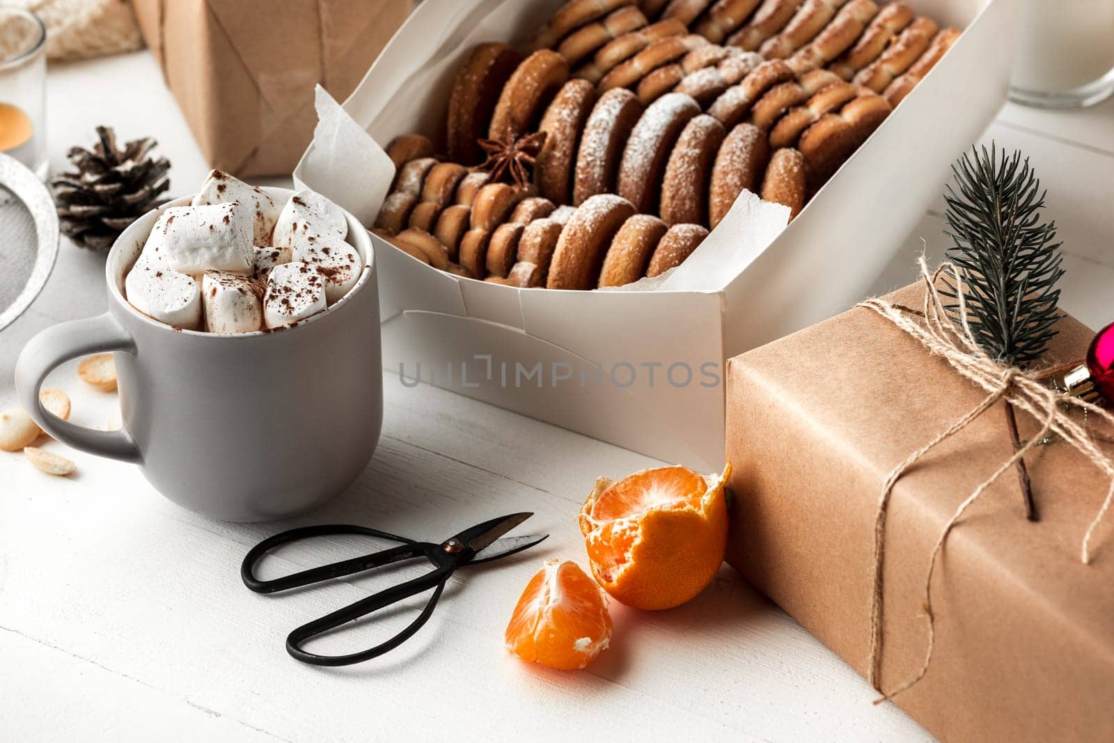 Homemade bakery making, gingerbread cookies in form of Christmas tree and gifts. New year treat for Santa Claus cooking. Homemade bakery, xmas sweet, winter holidays concept.