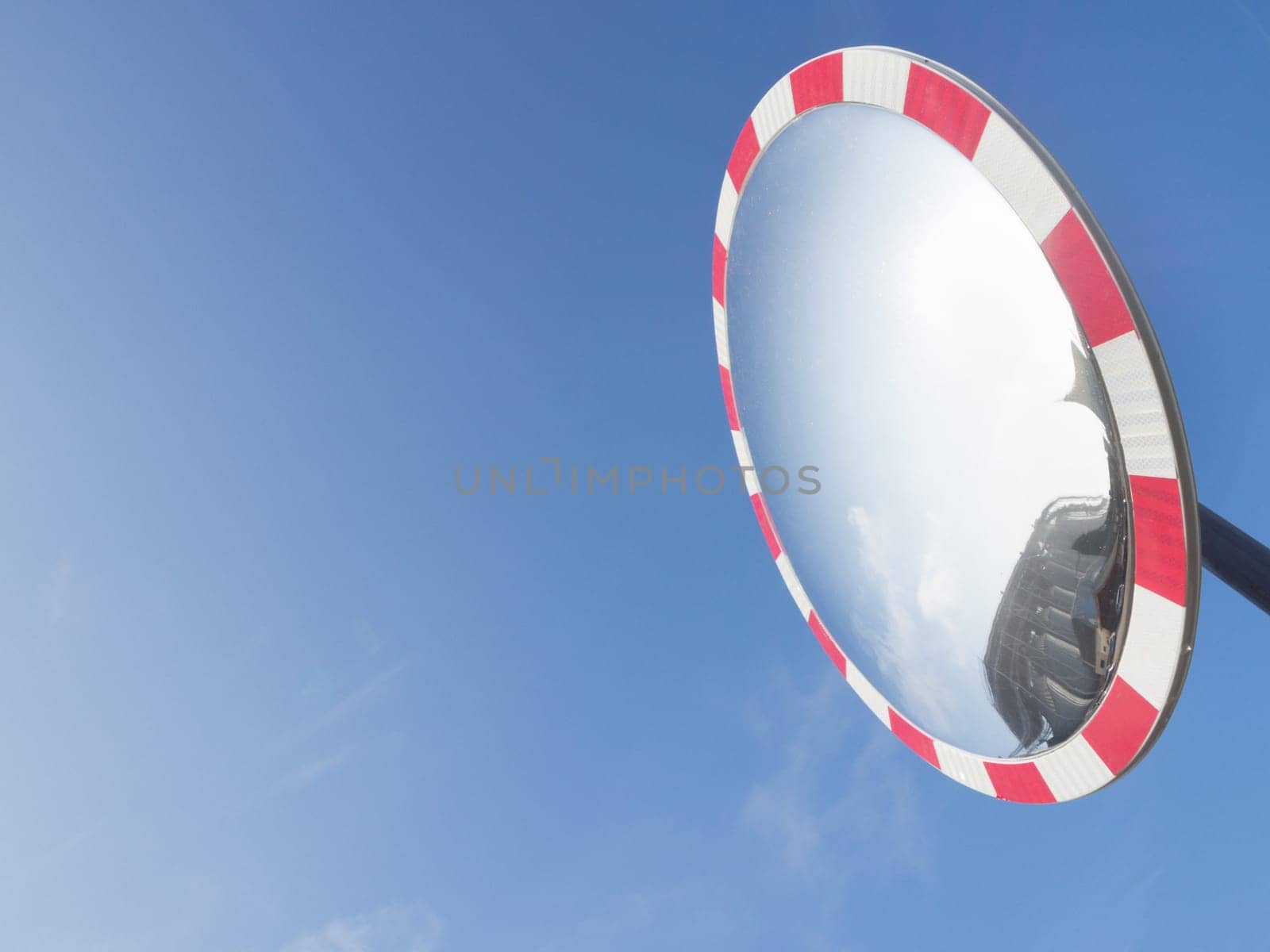 Sky reflection glass. Particular of a round glass, used on the road