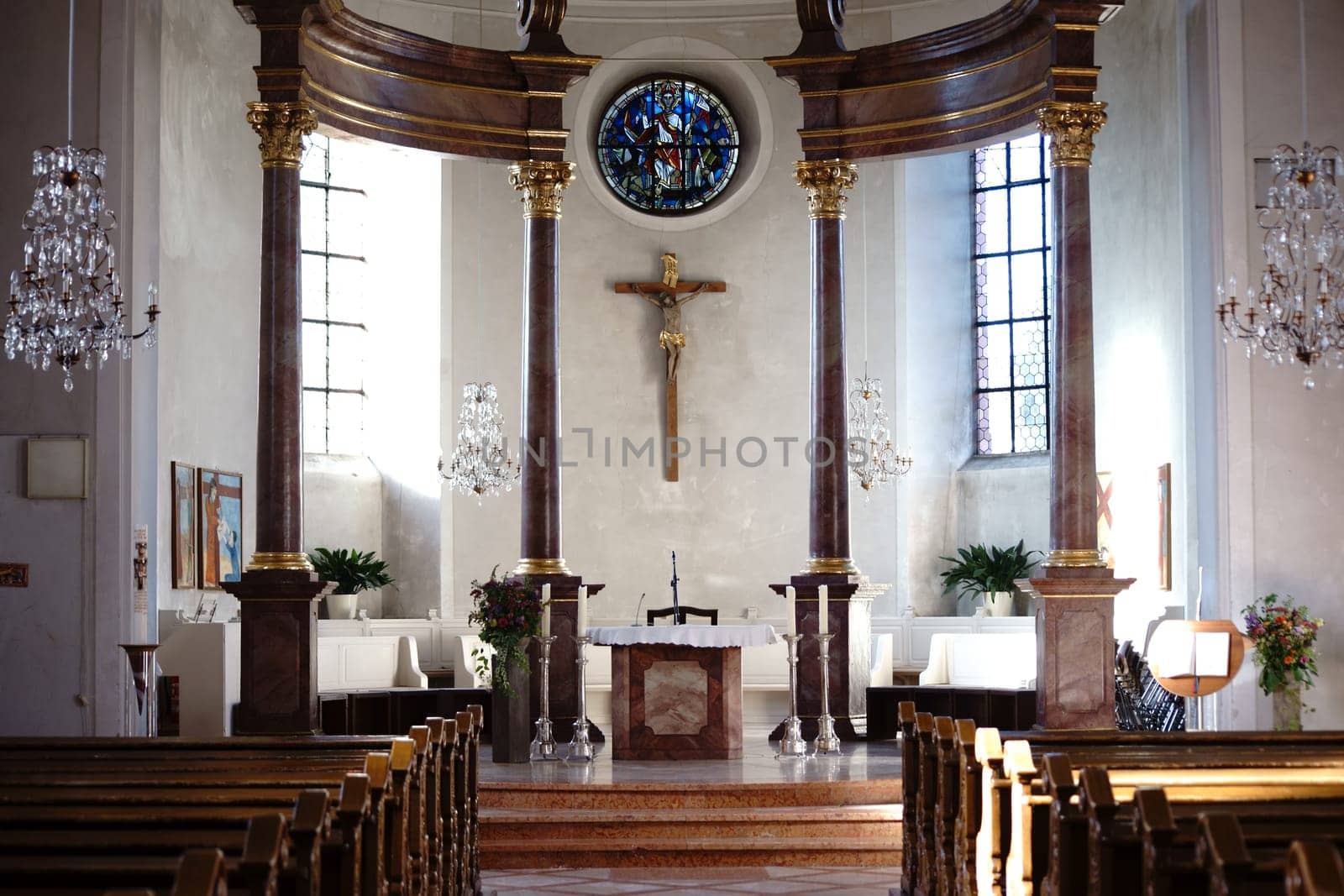 Nieder-Olm,Germany - October 14,2017: The columned altar and interior of the Catholic parish church of St. George on October 14,2017 in Nieder-Olm.