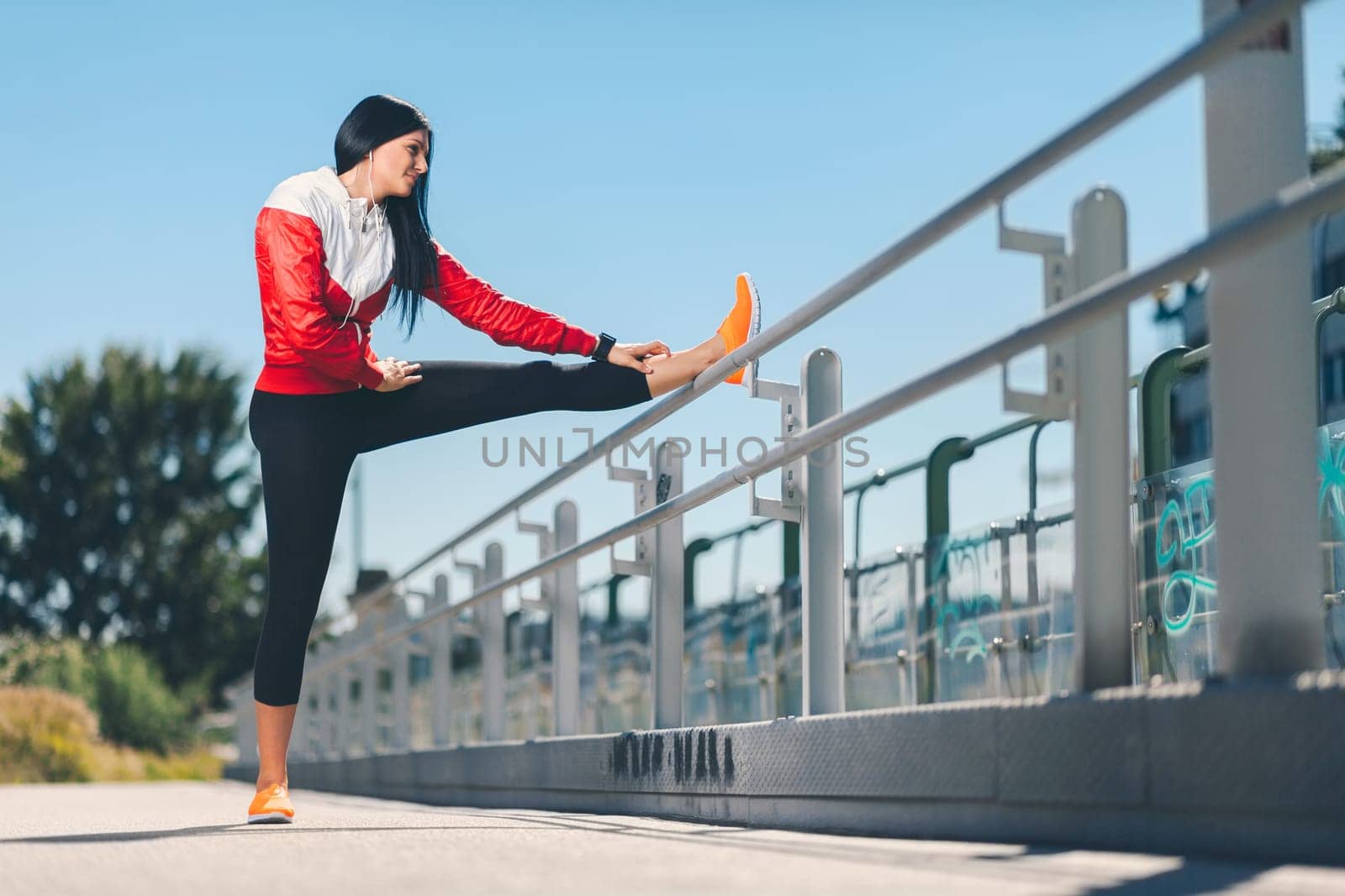 City workout. Beautiful young woman training in an urban setting