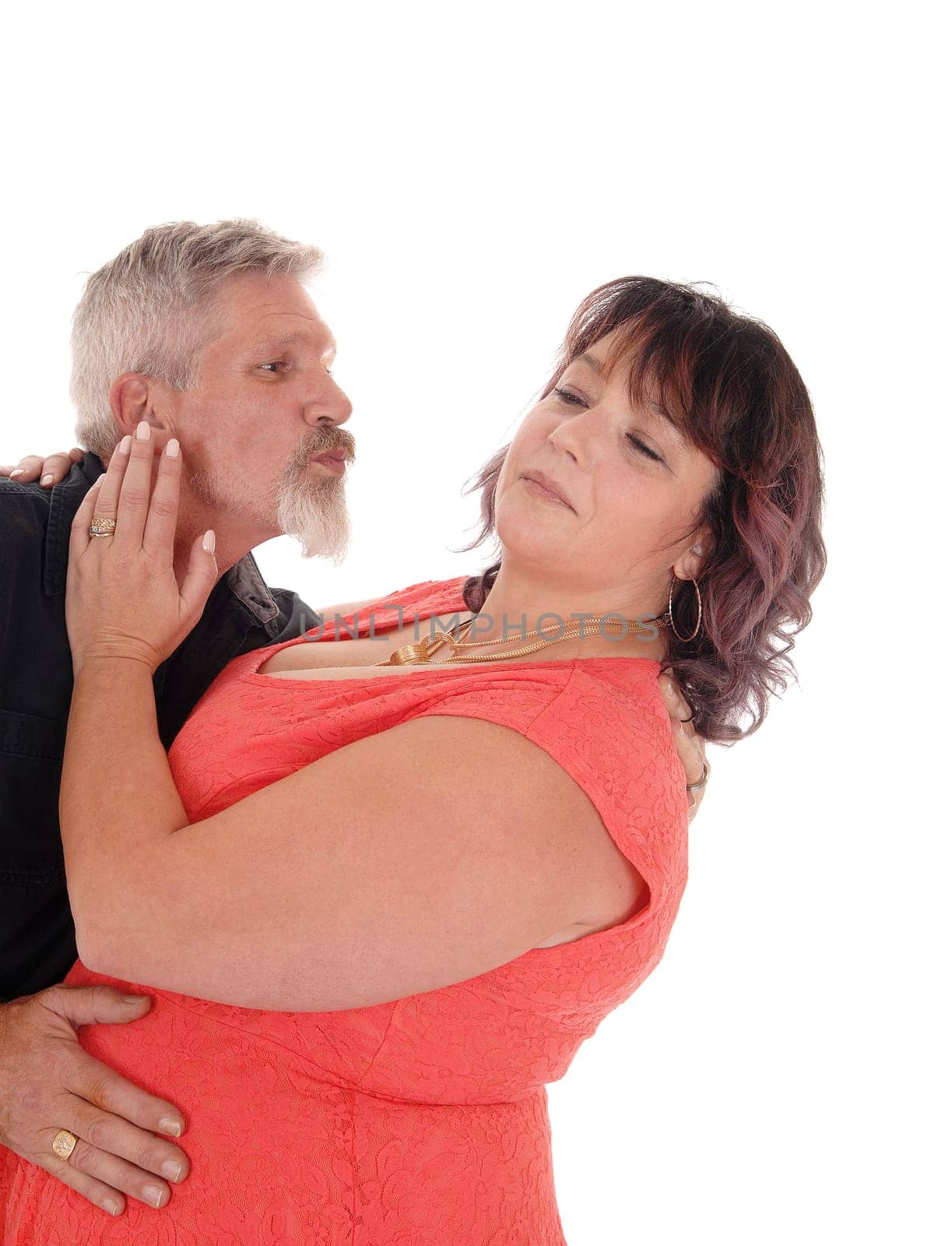 A closeup image of a couple the man like to kiss the wife, but she says.no, isolated for white background.