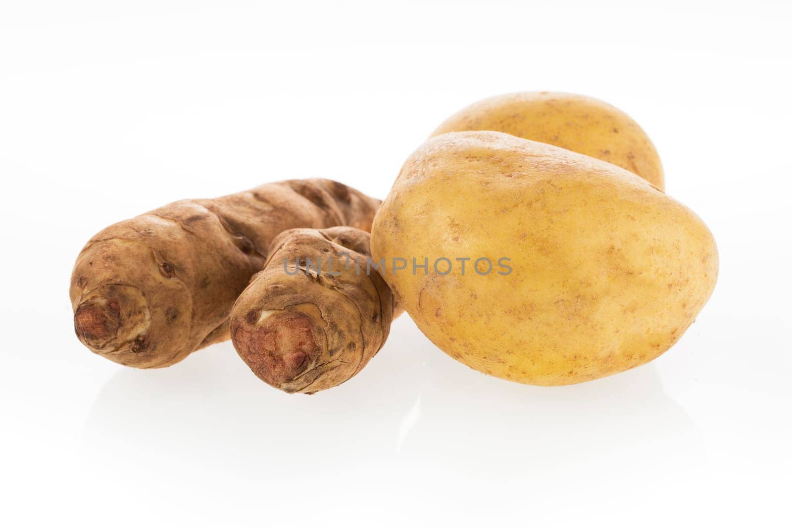 Potato and Jerusalem Artichokes isolated on white