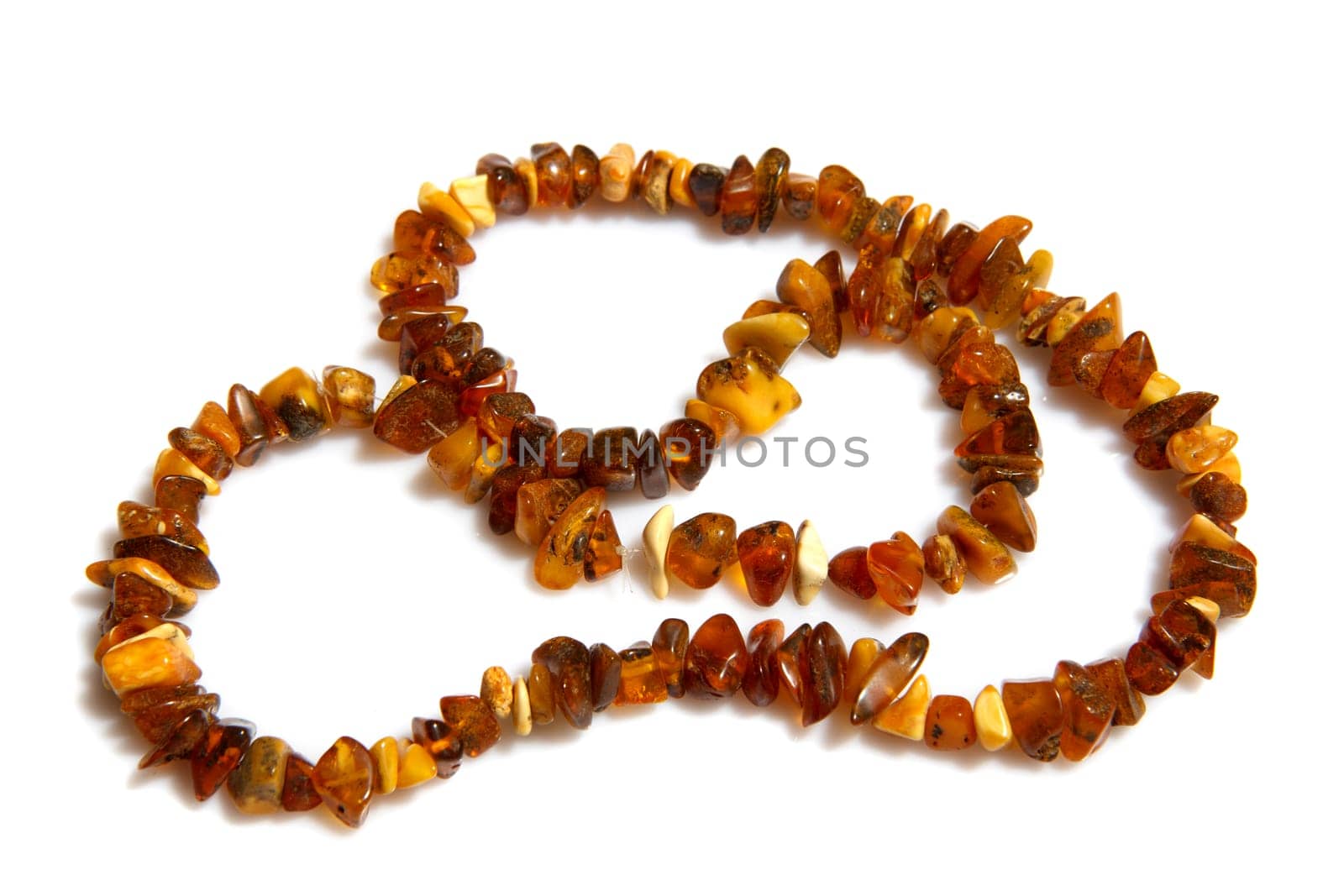 A beautiful amber necklace on white background