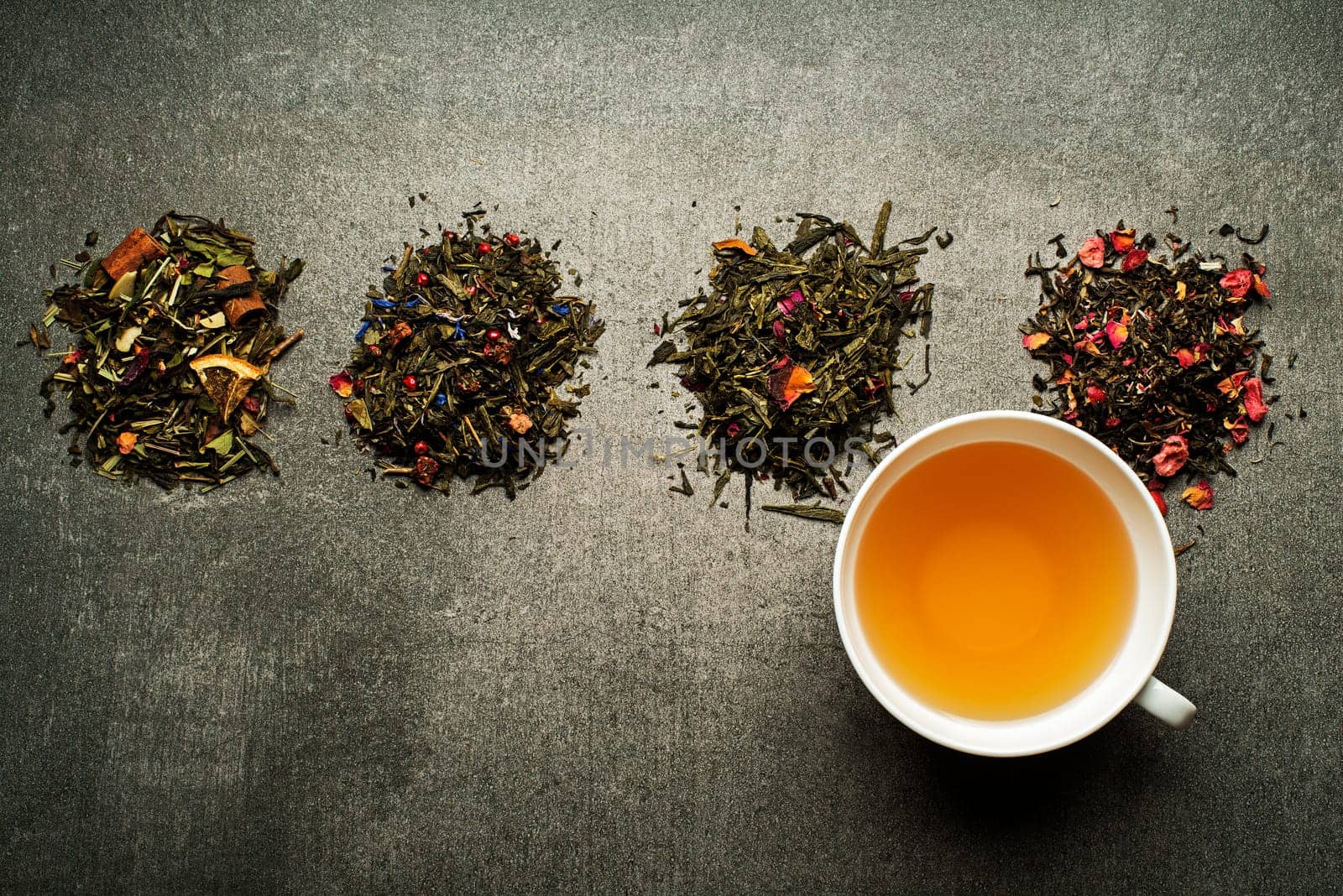 Cup of tea with dry tea collection of different types