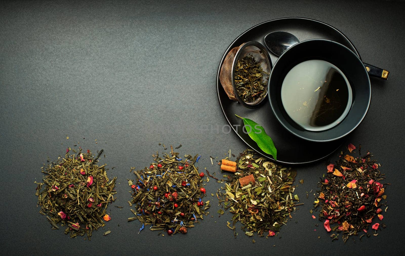Cup of tea with dry tea collection of different types