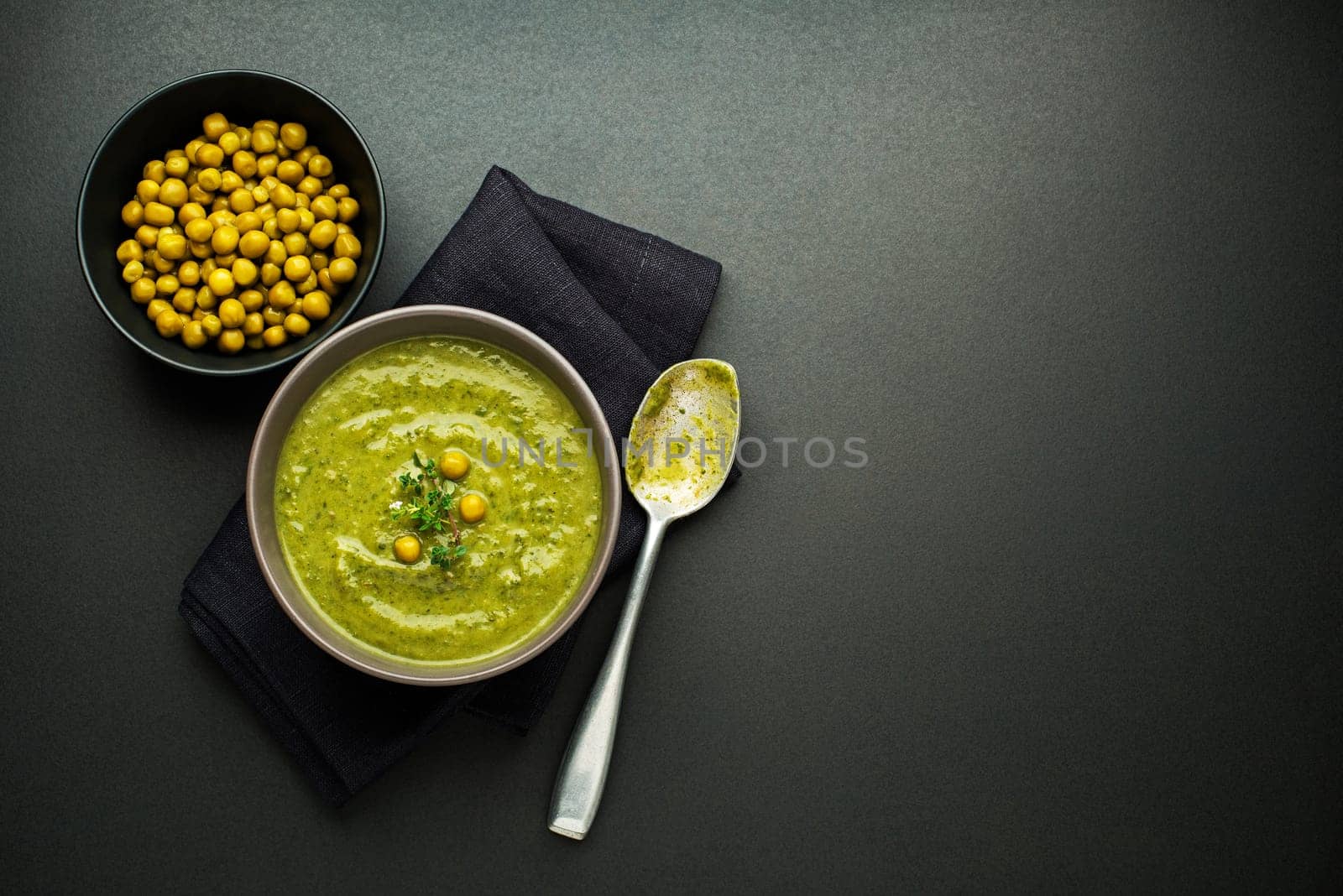 Fresh healthy vegetable pea soup overhead shoot