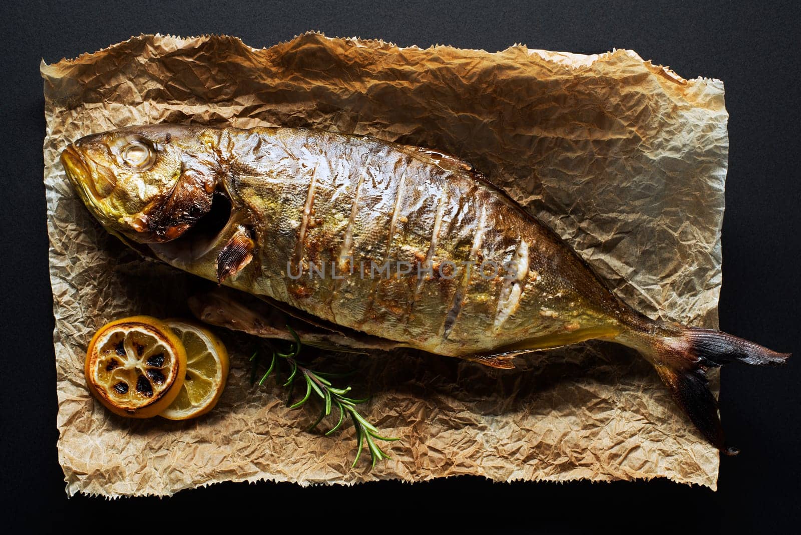 Grilled sea fish with lemon herbs and spices